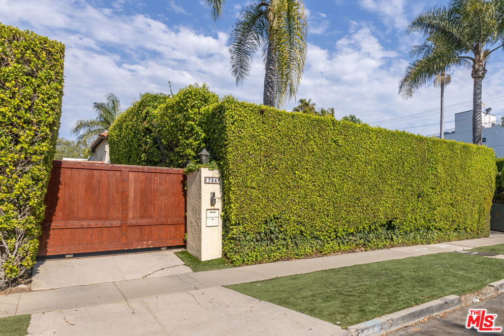Welcome to 724 N Spaulding Avenue - a stunning 1920s Spanish-style home located on a quiet, tree-lined street in the heart of Melrose Village. This beautifully preserved and thoughtfully updated 3-bedroom, 2-bathroom main residence blends classic character with modern comfort, offering refined indoor-outdoor living. Step inside to a sunlit living room featuring barreled ceilings, a decorative fireplace, and a large arched picture window that captures natural light throughout the day. The formal dining room leads to a beautifully renovated kitchen equipped with quartz countertops, stainless steel appliances, and custom cabinetry. The spacious primary suite offers a walk-in closet and French doors that open directly to a private backyard oasis. The outdoor space features a sparkling pool, mature landscaping, and multiple areas for lounging and dining ideal for entertaining or relaxing in the California sun. A detached guest house provides additional living space with its own entrance, perfect for guests, a home office, studio, or potential rental (buyer to verify use). Located just blocks from some of LA's best dining, shopping, and entertainment on Melrose Avenue, this home offers an exceptional combination of historic charm, modern amenities, and an unbeatable location.