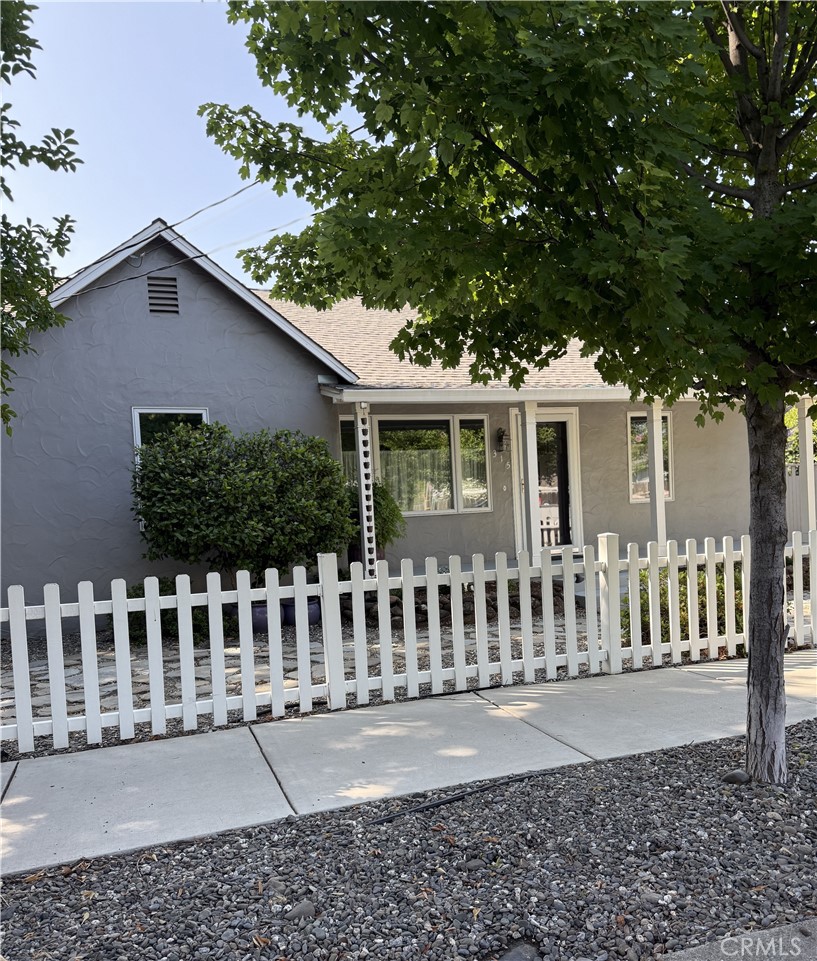 This charming cottage style home beautifully blends vintage character with modern, spa-like touches. Graceful arched doorways define the layout, with gleaming wood floors creating a cozy, inviting flow from room to room. Top of the line light fixtures, new kitchen with upscale appliances (all included), built in shelving, and premium countertops cast a soft glow reminiscent of boutique hotel styling. European styled gardens feature drip irrigation, pavers, sparkling patios and Zen vibes. The primary bathroom is a retreat and was professionally designed by Nantucket; a luxurious addition which you must see. This is all set in an inviting neighborhood where your home's value is set to grow. Close to award winning Enloe Hospital, downtown Farmer's market, and CSUC, this home also features upgraded heating and air, new Levelor window treatments, new pergola, newer roof, custom fencing, new Pella windows, and smart storm doors. The large, detached garage is perfect for hobbies, parking, or perhaps a future ADU. This home truly captures the best of both worlds: the warmth and intimacy of cottage living paired with the simplicity and serenity of modern spa design all in a top 10 Chico location.