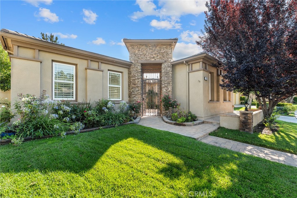 Welcome to this sprawling 4 bedroom single story home situated at the end of a cul-de-sac in Tournament Hills private, gated community. This home is just 3 doors down from the scenic community walking paths and beautiful community lake. This home has an open concept layout, with 4 bedrooms and 3 bathrooms. When you step inside from the private courtyard in front, you'll find a foyer and formal living room, a formal dining room and private office/bonus room (which could be made into a 5th bedroom). Further inside the home is an open family room with custom built-in cabinets, beautiful wooden beams and two-sided gas fireplace. The family room leads into an oversized open, updated kitchen with new cabinets, quartz countertops, upgraded appliances, and large island with hidden storage. A kitchen perfect for entertaining, cooking & baking. All 4 bedrooms and the office have ceiling fans and the entire home has beautiful custom wooden plantation shutters.
Out back you have a private yard with a large patio cover, custom pavers and the highlight - a gorgeous heated dark-bottom salt water pool and spa. The spa has its own added booster pump for more powerful jets. The backyard is great for entertaining and the french doors open into the beautiful family room and kitchen, so you can entertain both inside and outside. The backyard also features several mature fruit trees- pomegranate, apricot, apple and cherry trees, as well as garden boxes and pet-friendly artificial turf. This is a lower maintenance and energy efficient home. The builder equipped this home with an upgraded radiant barrier reflective insulation system, and the home was made more energy efficient with Tesla solar panels and Tesla Powerwall battery (governed under NEM 2.0), so you worry less about energy bills and the frequent rolling blackouts. PAID for Solar with acceptable offer. Two garages, one 2-car garage as well as one 1-car garage. Larger garage has built in cabinets giving plenty of storage, it's wired for easy installation of an EV charger. The entire home is equipped with a security alarm that allows for home automation options through alarm.com.
This home is close to the 10 freeway, elementary school, best grocery store & restaurants. Tournament Hills is a gated community offering private security. The expansive single story homes are coveted in this exclusive community and this layout is the best of them all. This home takes the cake with so many upgrades and options.