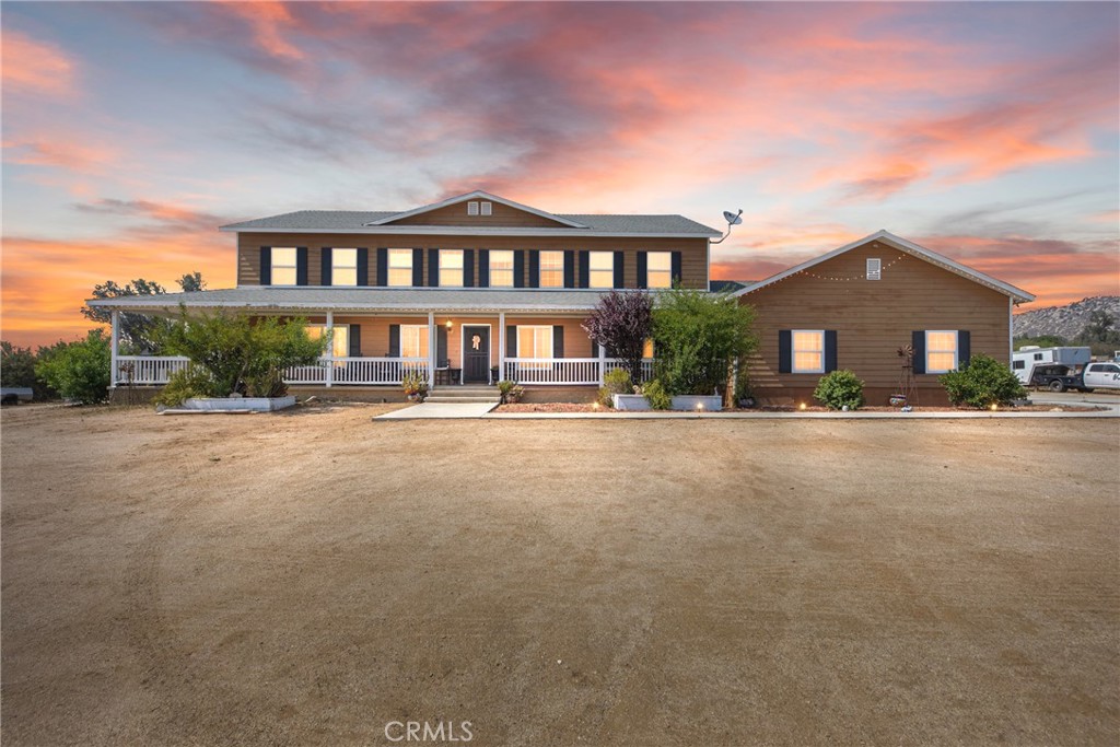 Welcome to 24450 Malaga Rd—a one-of-a-kind ranch-style retreat sitting on over 5 acres of wide-open land, offering 4,174 square feet of spacious living. With 5 bedrooms and 4.5 bathrooms, there’s plenty of room for the whole family to spread out, grow, and make memories. Pull into the oversized 5-car garage, step onto the wraparound front porch, and you’ll instantly feel like you’ve stepped into a scene from a classic country movie. Imagine yourself relaxing on a rocking chair with your favorite drink in hand, watching the sun set over your own slice of Southern California.
Inside, the unique open layout was designed with real life in mind—kids running freely, family gatherings, or entertaining friends on a grand scale. The heart of the home flows effortlessly from room to room, giving it that light, welcoming energy. There’s space for everyone here—whether you're hosting a holiday dinner or just enjoying a cozy night in.
The property is already set up with horse stalls, but that’s just the beginning. There’s endless potential to turn this land into whatever your dream lifestyle looks like—maybe it’s a sparkling pool oasis, an outdoor kitchen for BBQ weekends, or a garden retreat under the stars. Tucked away in a quiet, peaceful area, yet close enough to town for daily conveniences, this home offers the best of both worlds—privacy, space, and opportunity. 24450 Malaga Rd is more than a house... it's a place to build your vision, live freely, and truly feel at home.