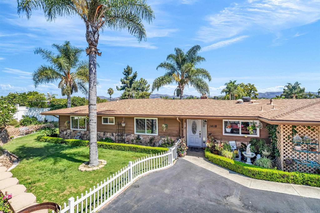 Welcome to this charming 3-bedroom, 2-bath traditional home nestled in the heart of Vista. This residence offers peaceful surroundings and scenic views, creating a serene escape while still being close to everything. The beautifully landscaped yard features thriving fruit trees, a lush lawn and colorful flowers, providing the perfect space for gardening, entertaining, or simply relaxing in the quiet atmosphere. Conveniently located near the 78 freeway, downtown Vista, shopping, and dining, this home is a must see for anyone seeking the comfort and convenience the beautiful city of Vista has to offer.