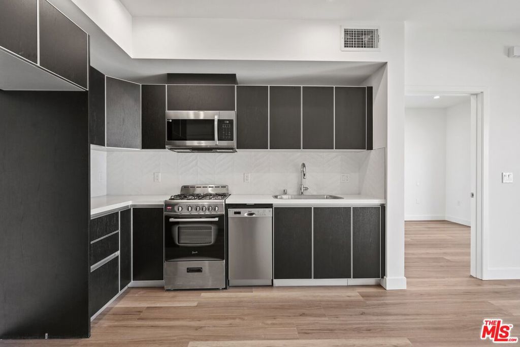 Welcome to Motor Midway, your premier destination in the heart of Palms, Los Angeles!Experience the pinnacle of modern living in the prestigious Palms area of Los Angeles. Motor Midway is a brand-new construction featuring one-, two, and three-bedroom units designed with you in mind. Be the first to revel in the elegance and sophistication of your new home.Our units boast expansive, open-concept floor plans that blend style and comfort seamlessly. Each unit comes equipped with the convenience of an in-unit washer and dryer, as well as stainless steel and energy-efficient appliances in the kitchen. Every detail has been meticulously crafted to create an atmosphere of pure comfort. And with commercial spaces on the ground level, essential services and shopping are just an elevator ride away.Our new community features a spectacular rooftop deck, perfect for sunning, lounging, and hanging out with friends. Bask in the California sunshine, enjoy breathtaking views, and create unforgettable memories right at your doorstep.Nestled near the 405 and 10 freeways, you can effortlessly access all the vibrant attractions and business districts Los Angeles offers. Satisfy your culinary cravings with top-rated restaurants just moments from your doorstep, and enjoy the lively atmosphere of downtown Culver City, merely a stone's throw away.Don't miss your chance to live in one of Los Angeles' most sought-after neighborhoods. Motor Midway is the epitome of luxury, convenience, and modern living. Schedule your tour today and secure your spot in this exclusive community. Your new home awaits!Flexible lease terms for victims of the Los Angeles fires. All utilities are the responsibility of the tenant.