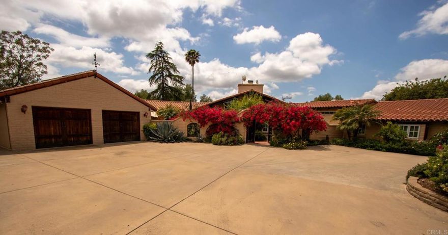 Santa Barbara style "Weir Brothers" Adobe Hacienda on 4+ acres...including a .77 acre buildable lot valued at $125k! A rare find that exudes charm, romance and history. Boasts a sprawling great room, with cathedral ceilings, enormous raised-hearth fireplace, and reclaimed wood beams throughout. Preceding the grand foyer, you’ll enter through a hand-crafted wood-and-iron “Puerto” into a beautiful Courtyard; garden, patio, and fountain. Perfect for entertaining; extensive parking and patios, has been a great wedding venue! The “Guest Wing” with its own courtyard entrance, is perfect for your second generation, In-laws, or as an income generating ADU. Enjoy beautiful verandas and gardens through the expansive double-paned french doors and windows. Spend lazy days enjoying the 360-degree view, laying by the pool, gazing at clear night skies from a hot jacuzzi; living the resort life in your own home! Zoned for agriculture & animals; enjoy fruit from your own trees, and roses from your own garden! Live the country life…while being freeway close to San Diego. Enjoy 50+ wineries in nearby Temecula…or maybe…create a winery of your own! Comes with “fully-owned" 10-kw Solar Panels, 42-kw Tesla Power Wall, and a private irrigation well. Room for animals to run with 3+ fenced acres, and a beautiful wrought-iron entry gate for added security. WEIR ADOBE HOMES: The Weir Brothers built approximately 250 Adobes in SD County…many included the curated “Adobe Homes Tour” that gave people opportunity to experience these architectural masterpieces. According to the builder they cost at least 15% more than conventional construction. But for those who could afford them, it was worth it for the increased insulation value, fire resistance, thermal advantages, and pure beauty of Adobe!