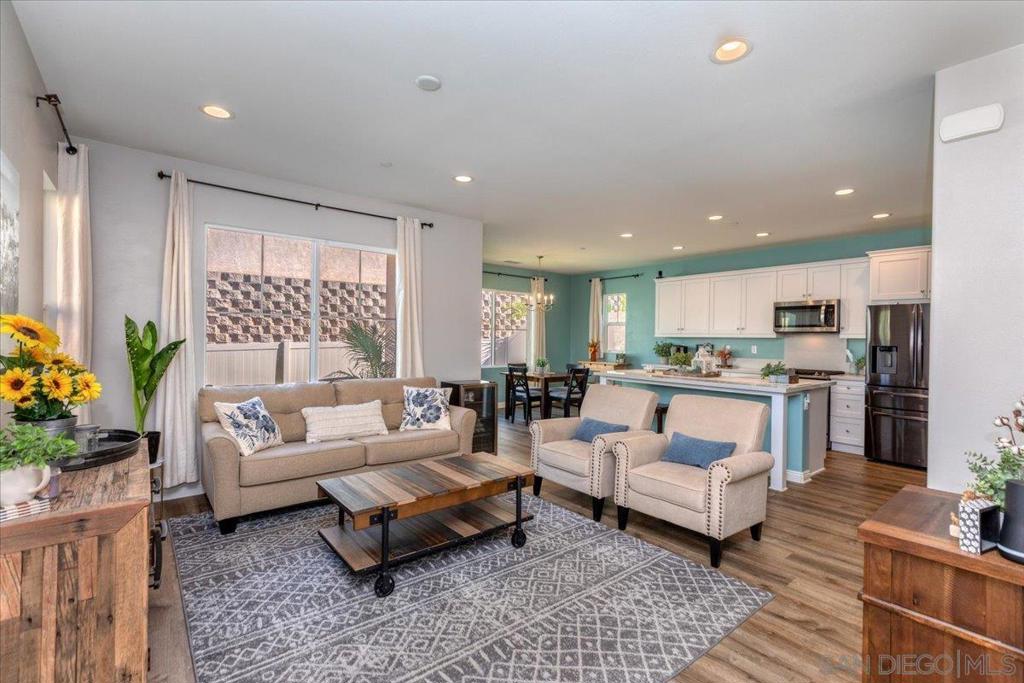 ***Seller will consider offers between $835,000-$845,000, dependent on terms. *** Welcome to this beautiful home in the desirable Main Ranch community, a modern neighborhood built in 2020. Step inside to find an open-concept layout where the living room, dining area, and kitchen flow seamlessly together under soaring ceilings, creating a bright and inviting space. The chef’s kitchen is designed for both style and function, with soft-close cabinetry, a gas range, spacious island, and convenient pantry. Upstairs, you’ll find all three bedrooms, a versatile loft, and a laundry room complete with extra storage. The expansive primary suite is a true retreat, large enough for a cozy reading nook. The en-suite bathroom features double sinks, a walk-in shower, a private water closet, and a generous walk-in closet. Enjoy low-maintenance outdoor living with artificial turf, a durable vinyl fence, and ample room to relax or entertain. Just off the deck, you’ll find a pre-plumbed gas line, ready for a future BBQ or firepit. Energy-efficient upgrades include tankless hot water and a whole house fan. The HOA maintains the front yard and provides access to community amenities such as a grassy open area and playground. This home perfectly blends modern comfort, energy efficiency, and community living—ready for you to move in and enjoy. Please see virtual tour for more details and layout.