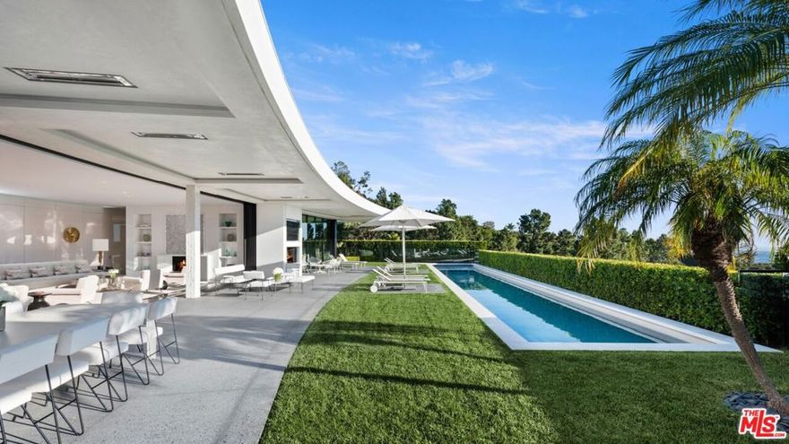Welcome home to this newly completed Mid-Century modern designed by the master of Mid-Century architecture William Hefner AIA. Very rare opportunity in Trousdale to find 10,000+ SF of new ground up high-end construction. Designed for a family but could be the ultimate couples house. Trousdale is situated at the 50-yard line of Beverly Hills in the most exclusive neighborhood, moments from the best shopping and restaurants. This is why all the titans of the industry flock to this incredible luxurious lifestyle. Gated drive and lush greenery surround the home for ultimate privacy. Oversized rooms with high ceilings and the finest finishes, 6 BD, 8 BA, pool, and all the latest and greatest amenities. Primary suite offers a spa-like bathroom clad in gorgeous polished Pentelikon, designer walk-in closet, and sweeping views. Fully automated Crestron estate is complete with executive office, media room, theater, fitness center, temperature-controlled wine cellar, and two-car garage with lift for 2 additional cars. All the rooms, in all the right places with sunlight and views everywhere and the best finishes throughout. This home is perfection and the pinnacle of Trousdale living.