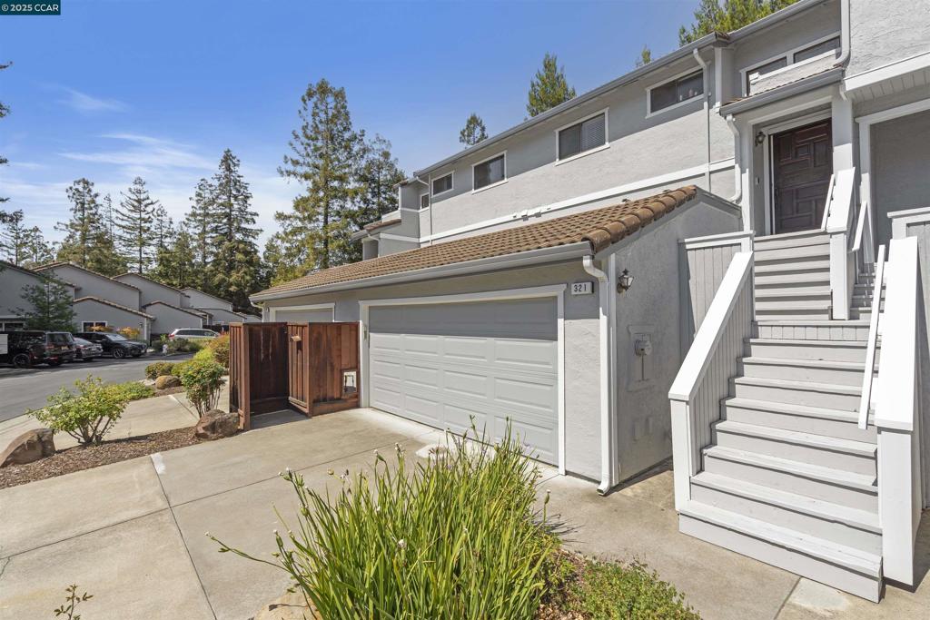 Welcome to 321 Via Cordova Lane an updated Townhome in Mission Pines! Tucked into the sought-after Mission Pines community, this beautiful townhouse offers light-filled living, modern comfort, and a floor plan that fits your everyday lifestyle. Step inside to find an open and airy living space featuring a cozy gas fireplace and built-in wet bar, with sliding doors leading to a private fenced patio; perfect for sipping your morning coffee or winding down after a long day. The kitchen features abundant storage, a gas range, and pantry, flowing seamlessly into the dining area for easy entertaining. A spacious bathroom on the main level adds extra convenience. Upstairs, the oversized primary suite offers a peaceful retreat with its own private balcony and en-suite bath. A second bedroom, full hall bath, and in-unit laundry complete the upper level. Additional highlights include a newer central HVAC system and an attached 2-car garage. The community offers a pool, tennis courts, clubhouse, and serene green surroundings. All just minutes from top-rated Martinez schools, shopping, parks, trails, BART, freeways, and the charming downtown and marina.