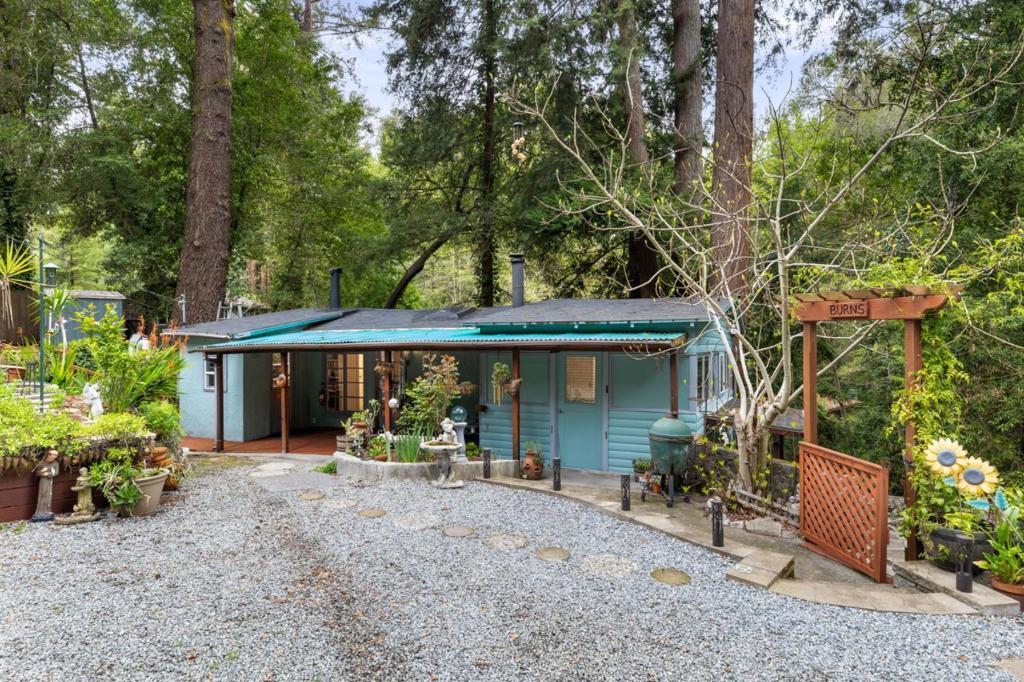 A Diamond in the Rough! Nestled in the redwoods of the Santa Cruz Mountains, this 2-bedroom, 1-bathroom cabin presents a rare opportunity for investors or buyers with a vision to transform this space into a mountain retreat or cozy home. While the property does need work, its a blank canvas ready for someone to add their personal touch and make it their own. The 739 sq. ft. home features a galley-style kitchen, family room with a dining area, two bedrooms, and a bathroom. A bonus room and additional storage on the lower level (not included in square footage) provide extra flexibility for future improvements. Enjoy the outdoors with a hot tub on the patio, along with a covered porch and deck. The large front yard offers space for gardening, expansion, or creating your own outdoor oasis. Located just a block from Garrahan Park, with convenient public transport nearby, plus walking distance to the Sawmill restaurant for local dining and live music. This family-friendly neighborhood boasts nearby hiking and biking trails, with historic downtown Boulder Creek just a short drive away, offering shops, a library, and art events. It also has easy access to Highway 9, making commuting to Silicon Valley is a breeze. The possibilities for a savvy investor or homebuyer are endless!