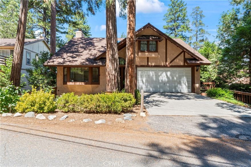 Discover the timeless charm of this beautiful lake-close home, situated on a street-to-street lot in the highly sought-after San Moritz area of Lake Gregory. This retreat features a 3-car garage with extra workshop and storage space, a picturesque treed lot, and spacious rooms throughout. 



The popular reverse-floorplan includes two large bedrooms (one with a cozy window seat) and a lovely bathroom, along with an easily accessible garage. Downstairs, you'll find a stunning open floorplan filled with natural light, a spacious kitchen with an oversized chef's pantry/laundry room, dining area, and an expansive living room complete with a wood-burning stove. Step outside to a serene deck nestled among the trees, or head downstairs to the massive, ready-to-finish basement and a path leading to the street below and the lake. 



Essential updates include air conditioning, HVAC, roof, back-up generator, and more. The kitchen boasts an abundance of oak cabinets, so pristine they appear brand new. The primary bedroom, just off the living room, offers a private retreat with dual pocket doors, a soaking tub, and a spacious, secluded atmosphere. This home is truly a gem, waiting for its next owner.