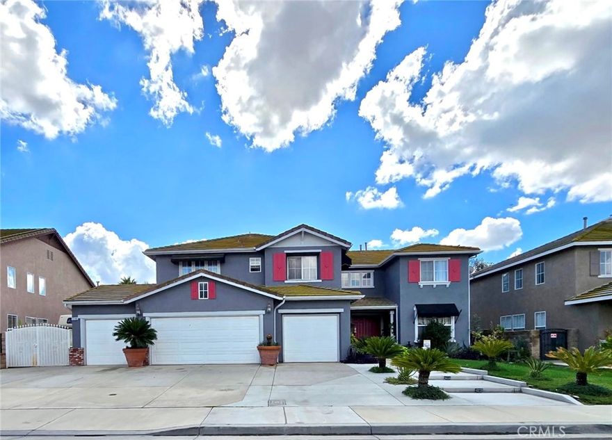 Welcome to your dream home — where luxury, functionality, and fun come together in perfect harmony!

This beautifully upgraded 6-bedroom, 4-bath residence offers nearly 3,604 sq. ft. of refined living space on a generous 11,065 sq. ft. lot with RV parking. Step through the double-door entry way into a grand space featuring high ceilings and an elegant formal living and dining room adorned with marble flooring throughout the first floor. The spacious kitchen has been tastefully remodeled with a white quartz island and matching backsplash featuring gold-veined accents, built-in microwave and oven, and a walk-in pantry. The laundry room is conveniently located behind the kitchen area and adds to the home’s practicality.

The inviting family room features a cozy fireplace, while the wood staircase with white risers leads to the second floor, where wood flooring continues throughout. The master bedroom offers a true retreat with access to a private deck featuring a retractable awning, dual vanities, a separate shower, whirlpool jetted tub, and a generously sized walk-in closet. There are four additional bedrooms on the second floor, as well as two bathrooms with one featuring a Jack-and-Jill layout. There is an additional bedroom with a full bath, perfect for guests or multi-generational living.

Designed for entertaining and everyday enjoyment, the backyard oasis boasts an expansive covered patio with two ceiling fans, three motorized custom patio shades, block planters, and fruit trees that enhance both privacy and charm. The side yard also has enough space for RV access. 

A four-car garage provides ample space for vehicles, storage, or even a future ADU conversion.