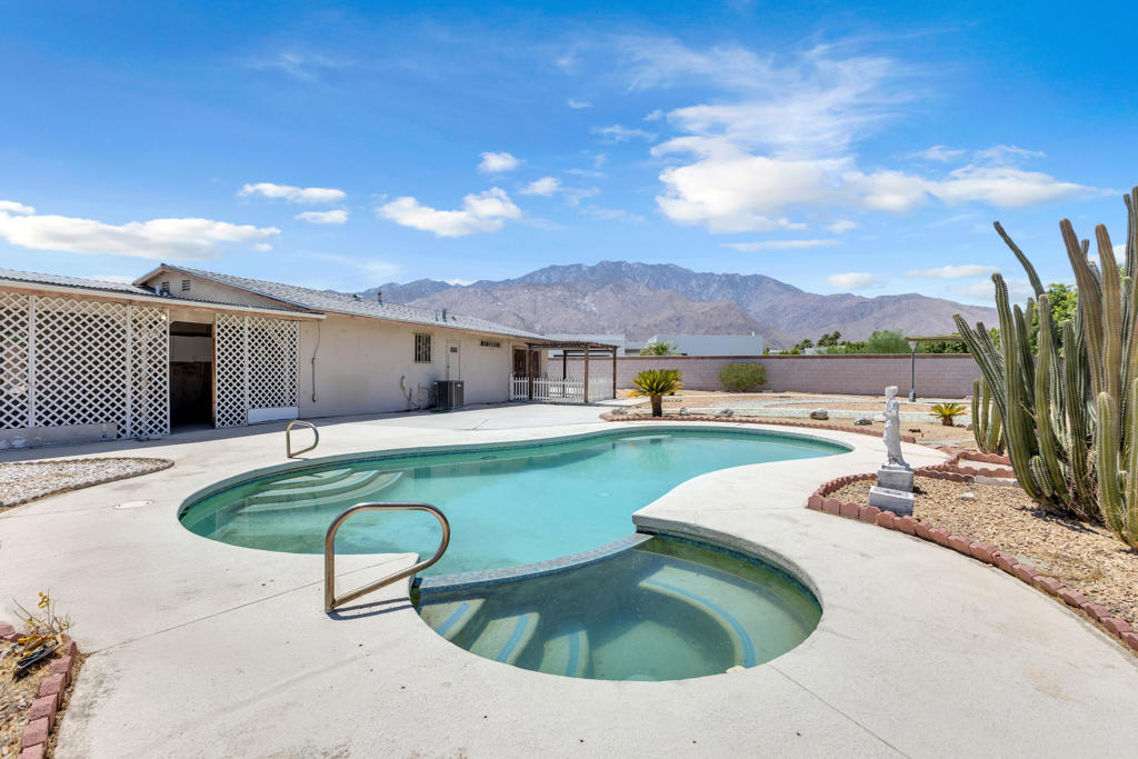Investor Opportunity - Prime Palm Springs Lot with Views! Located on a massive 16,553 sq ft lot with unobstructed mountain views, this centrally located 3-bedroom, 2.5-bathroom property offers incredible potential for investors, flippers, or builders. The interior is original, providing a blank canvas for your vision--whether you're planning a full renovation, a luxury reimagining, or a vacation rental transformation. The home has been well-maintained and loved over the years but is ready for its next chapter. Outside, the property features a fully walled yard, automatic gate, RV parking, storage shed, and a pool and spa with newer equipment--plus a 2-car garage with access to both the home and backyard. Just minutes from downtown Palm Springs, shopping, dining, the museum, and the airport, this home is positioned in one of the desert's most in-demand areas.Property is being sold as-is, offering a rare chance to invest in size, location, and long-term upside.