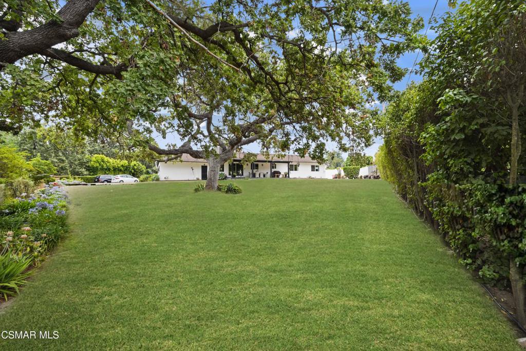 Welcome to this fully renovated modern farmhouse on over an acre in the heart of Conejo Oaks. This property offers the perfect blend of privacy, charm, and modern upgrades.Step inside to a fully remodeled interior featuring a spacious, open-concept kitchen--beautifully designed with high-end finishes and perfect for both everyday living and entertaining. The freshly painted exterior gives the home a crisp, updated curb appeal, while inside, every detail has been thoughtfully renovated for comfort and style.Relax on the covered porch overlooking the expansive backyard, where a majestic oak tree offers natural beauty and shade. The yard provides plenty of space to create your dream outdoor oasis.A true standout feature is the custom-made pivot front door, adding a touch of elegance and craftsmanship from the moment you arrive.Don't miss this rare opportunity to own a move-in-ready home in one of Thousand Oaks' most desirable communities. The grass on the first photo is photoshopped.