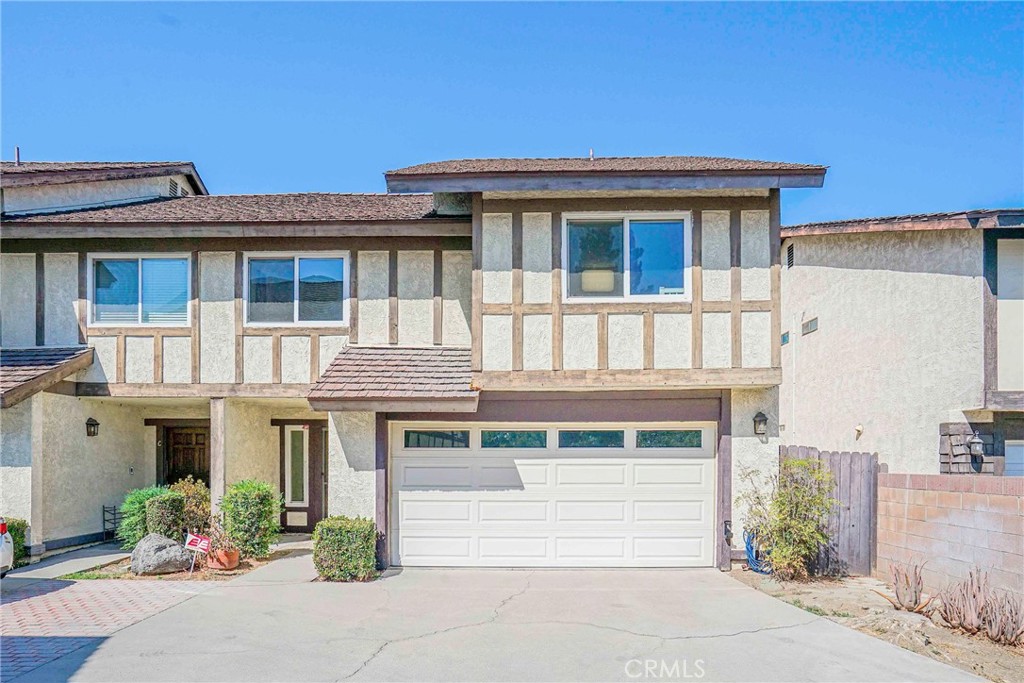 Discover this inviting townhome nestled in a quiet, well-maintained community within the award-winning Arcadia School District. Offering 3 bedrooms, 2.5 bathrooms, and 1,690 sq. ft. of living space, this desirable home also features a generous private backyard. The first floor boasts an open layout with laminate flooring, a bright living room with a separate wall-mount cooling/heating unit to save energy, and a versatile family/dining area with a cozy fireplace. The updated kitchen is appointed with quartz countertops, a stylish tile backsplash, custom cabinetry, stainless steel appliances, and wood-look tile flooring. Upstairs, the primary suite includes a private balcony ideal for morning coffee or evening relaxation, a walk-in closet, dual vanity, and shower over tub. Two additional bedrooms, a spacious den, a hallway bath with shower, and a convenient laundry closet complete the second level. Additional highlights include a two-car garage equipped with 220V for EV charging and a side-yard water softener. The low monthly HOA covers water, trash, landscaping, and homeowner’s insurance. Ideally situated just minutes from Arcadia County Park, the Public Library, The Shops at Santa Anita, the Arboretum, Santa Anita Golf Course, and a wide selection of dining and shopping options. With close access to major streets and freeways, this move-in ready home is a rare opportunity in one of Arcadia’s most desirable neighborhoods.