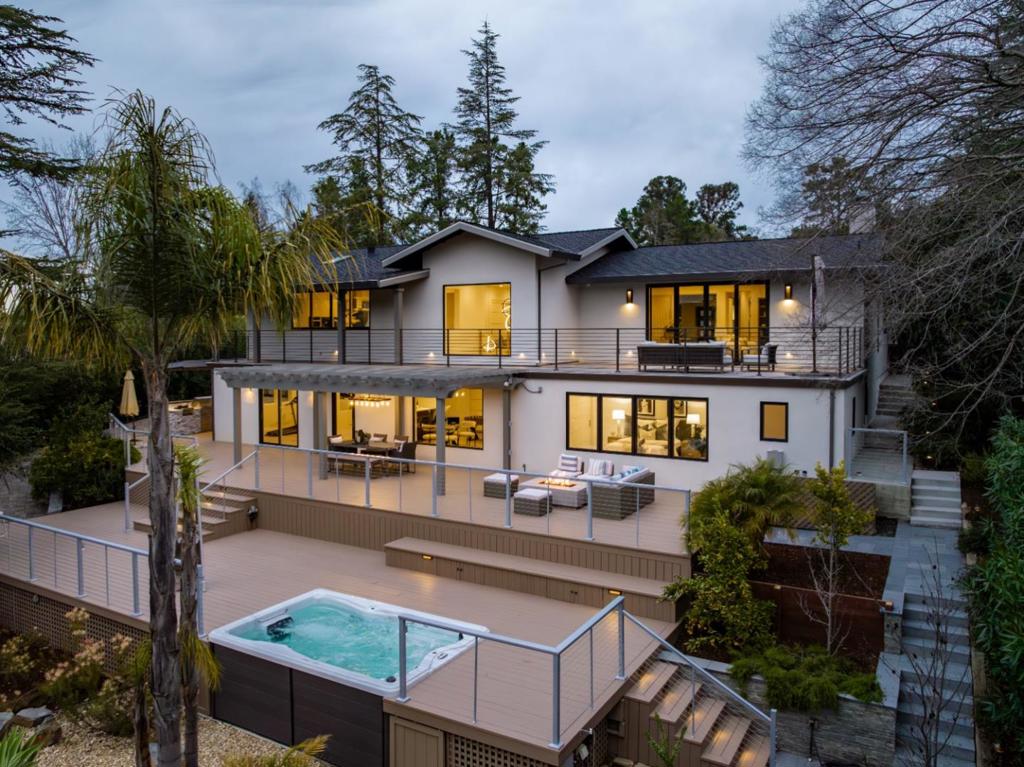 Celebrate the ultimate in modern luxury in West Menlo Park! Custom design completed in 2020 with no expense spared. Top-of-the-line finishes and amenities including luxury wide-plank floors, soaring 10 ceilings, leathered stone fireplace, Porcelanosa curated bathrooms, Leicht German white lacquered kitchen cabinets, Miele appliance suite, built-in speakers, and French light fixtures. 5 bedrooms & 5.5 bathrooms on 2 levels, 2 studies/offices, gym, wine bar, game room and home theater. Main level centered around a relaxing atrium connecting rooms on 3 sides. Stunning views of the Sharon Park Pond and Sharon Heights Golf Course 8th hole. Resort-inspired grounds with multiple expansive decks, built-in summer kitchen, pergola, fire pits, and swim spa. Smart home enabled. Air conditioned. EV 240V outlet in the garage. Easy access to Stanford, 280, and leading tech campuses. Acclaimed Las Lomitas school district. This showstopper is ready for you to move in! Art pieces for sale as priced.