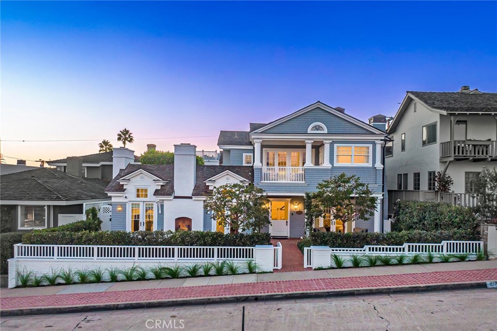 Outstanding custom Cape Cod home on a double lot in one of the best locations in the Village. This stunning property showcases a unique, eye-catching blend of East Coast classic beach estate living and the comfort and relaxation of Corona del Mar. It features 6 spacious bedrooms, including a guest casita, 7 baths, a library, secondary utility kitchen, subterranean bonus room, large courtyard with a spa, rooftop deck with incredible ocean views, and a 3-car garage. The main floor welcomes you with a cozy ocean-view brick patio and fireplace. Upon entering, you'll be greeted by wood-beamed vaulted ceilings, classic dark walnut floors, a formal sitting room, and a large dining area with a wine feature. The gourmet kitchen, equipped with Viking appliances and Bosch dishwasher, Island, large pantry, skylights, and a dutch door to courtyard. The main level also includes a guest suite, laundry room with a secondary utility kitchen, and a dog bath. Outside, the large private courtyard with a spa leads to a private guest room or casita with a bath. The second level features a spacious master retreat with fireplace, a luxurious bath, massive walk-in closet, separate sitting area, and a balcony with beautiful ocean views. This floor also includes 3 guest suites, a formal library, and an office. On the third floor, a large rooftop deck offers stunning views of the ocean, bay, Fashion Island, and more. The home also boasts a subterranean bonus or game room and a 3-car garage. This is truly one of the most impressive and rare finds the Village has to offer, with its abundance of space, outdoor comfort, meticulous design, and picturesque views, all within close proximity to Ocean Blvd and Big Corona Beach.