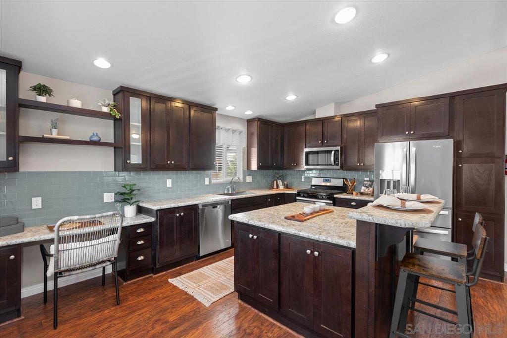 Seller considering offers between $369,000-$389,000-Built in 2016, this well-maintained home offers modern comfort, thoughtful design, and a prime location. The spacious open kitchen is the heart of the home, featuring sleek appliances, an island with a breakfast bar, & a handy office nook. The kitchen flows seamlessly into the living & dining areas, creating the perfect space for entertaining or relaxing. You’ll find 2 primary bedrooms with en-suites, ideal for hosting guests or enjoying your own private retreat. A 3rd bedroom offers flexibility for an office, hobby room, or extra sleeping space. The convenient laundry room also features storage. Step outside and enjoy the upgrades: a front porch with Trek flooring, custom blinds, & a rare fully enclosed vinyl-fenced yard—perfect for privacy or pets. The beautifully landscaped space features lush plants, low-maintenance turf, and custom paver walkways. The covered carport offers a ramp to the rear door, a custom awning, & a versatile shed for storage or a workshop. Lakeview residents enjoy wonderful amenities including a recreation room, pool, spa, green spaces, & optional RV parking. Space rent is approximately $620/month, & residents work together w/ park management to keep the land lease rent-controlled. Location is everything! Across the street is the San Marcos Creek Project w/ 1.5 miles of scenic trails & a park. Within 2 miles, you’ll find Creekside Marketplace and North City, where you can enjoy shopping, dining, & a weekly farmers market. This home is move-in ready and perfectly positioned for an active lifestyle!
