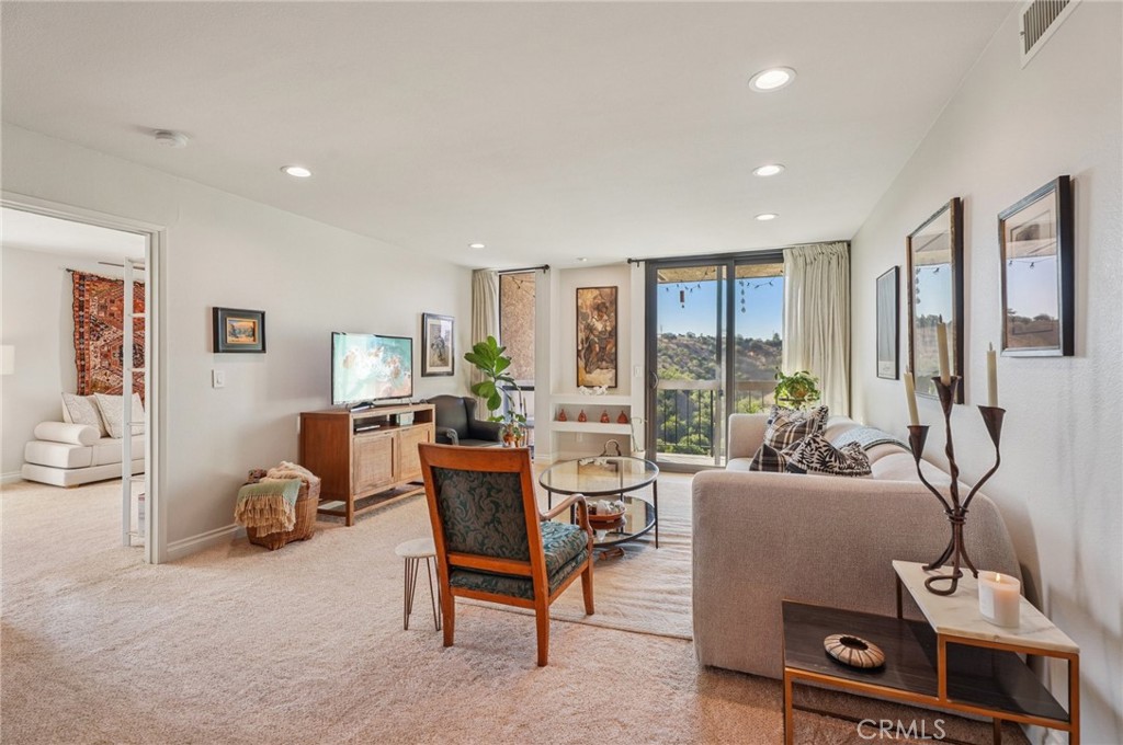 Welcome to 4239 Via Arbolada Ave #208!
Nestled in the highly sought-after hilltop community of Monterey Hills, this beautifully updated 2-bedroom, 2-bathroom condo offers 1,023 sq. ft. of serene living space. Perfectly positioned, the unit faces Debs Park, with canyon and park views enjoyed from both bedrooms and the spacious private balcony.
Each bedroom features its own en suite bathroom, and they are thoughtfully located in separate corners of the unit for optimal privacy—ideal for roommates, guests, or a home office setup.
Inside, you’ll find a thoughtfully designed floor plan with abundant natural light. The chef’s kitchen has been updated with newer appliances (refrigerator included), while the in-unit laundry room comes equipped with a newer washer and dryer. The central A/C system, installed less than five years ago, ensures year-round comfort. Other highlights include new flooring, ample closet/storage space, and two assigned parking spaces.
Enjoy peaceful living in a tranquil, park-like setting while being just minutes from Downtown LA, Dodger Stadium, South Pasadena, and local parks. Monterey Hills offers the perfect blend of quiet retreat and urban convenience.
Don’t miss this opportunity to own a slice of Monterey Hills living!
