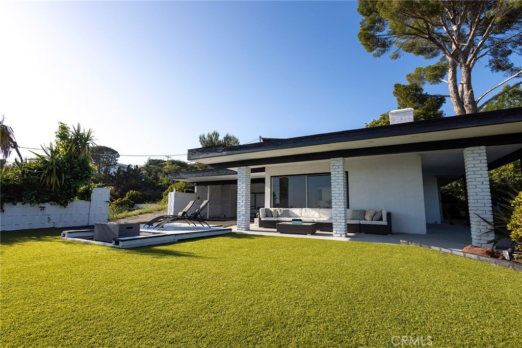 An exceptional value in BHPO. Attention Mid-Century modern enthusiasts and developers: Discover the perfect blend of architectural heritage and development potential at 9924 Beverly Grove Drive, a historic mid-century modern home for sale in Beverly Hills, perched atop a scenic knoll in the prestigious Beverly Hills Post Office. Surrounded by some of LA's most high-profile residents, including LeBron James, Lisa Kudrow, and Kylie Jenner, this star-studded enclave offers both prestige and privacy. Privately tucked away on a private road, this rare single-story residence offers breathtaking panoramic city views, exceptional privacy, and timeless design. Spanning approximately 2,582 square feet, the home features three spacious bedrooms, three bathrooms, and a striking indoor pool that creates a peaceful, spa-like atmosphere at the center of the home. The expansive living room was thoughtfully designed to take full advantage of the sweeping city views, offering a bright and open space ideal for both everyday living and entertaining. Set on nearly half an acre of prime Beverly Hills real estate, this historic mid-century property offers endless potential, whether for restoration or transformation. A pre-development study by a renowned Los Angeles architect outlines plans for a 5,300-6,000 sq ft estate across three levels. Developers may also benefit from the potential to lift current deed restrictions, opening the door to merging with adjacent parcels for expanded development opportunities. The current layout also presents cost-effective opportunities to expand the home's footprint and bedroom count, making it ideal for a developer or end user looking to maximize value in a highly sought-after location. Whether you're looking to restore a classic or build a luxurious custom estate, 9924 Beverly Grove Drive presents a rare opportunity to own a mid-century modern home with panoramic city views, exceptional privacy, and one of the few indoor pools found in Beverly Hills real estate offering a truly unique blend of architectural charm and lifestyle potential in the prestigious BHPO.