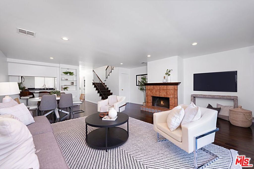 Wonderful Townhome living in a quaint building on a cul- de -sac street nestled between Mar Vista and Culver City. Pool side lounging feels so much like a vacation a great way to unwind at the end of the week. Open floorplan with large living room opening to the kitchen great for entertaining. Fireplace highlights the bright living room. Updated cooks kitchen with granite counters, breakfast bar and flower box window with lots of light. Two huge bedroom suites with room for a sitting area lots of closet space and both have en-suite bath. This close to the end unit has a larger patio than most in the complex. Central air conditioning and central heat, rich dark engineered floors, tankless water heater and so much more. Subterranean parking with two side-by-side spots. Close to Marina, Playa Vista, easy access around town and to airport.