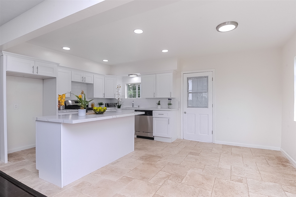 Beautifully remodeled house (3br 2ba) with a helper unit (2br 1ba) The main house is 3br 2ba in lovely Paradise Hills. Notable features include large front yard and backyard in a corner lot with sprinkler systems, Paid off 3.9 kWh Solar!, new kitchen cabinets, travertine tile, quartz tops, SS appliances, fresh interior/exterior paint, new vanities, freshly laid sod, original hardwood floor and new furnace! Helper unit is 2br 1ba with a new full kitchen, new shower. Neighborhoods: Paradise Hills Other Fees: 0 Sewer: Public Sewer Topography: LL