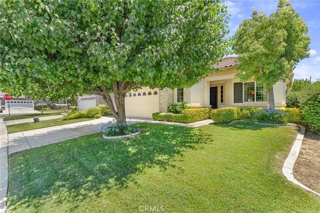 Popular "Trillion" model located in Solera Oak Valley Greens, a 55+ gated community. This lovingly maintained home is move-in ready. From the moment you enter, the vaulted ceilings and 8 ft. doors create an open and inviting atmosphere. Kitchen features stainless steel appliances, granite countertops and plenty of storage space. All appliances are included, making for a seamless move-in experience. The spacious open floor plan is perfect for entertaining guests or enjoying cozy evenings by the fireplace. The primary suite features both a walk-in shower and a soaking tub. A versatile office or third bedroom provides extra flexibility. The lush garden and picturesque backyard are truly breathtaking. Creating your own private oasis. The garage has an extra nook, perfect for a workbench or extra storage, plus plenty of cabinets and overhead shelving. Solera has a clubhouse, pool, spa, gym, indoor walking track, tennis courts, bocce ball, clubs to join, classes, and group trips. HOA includes basic Spectrum cable and internet. Conveniently located near Palm Springs, Redlands, Cabazon Outlets, Morongo Casino, and top golf courses, with quick access to the 10 fwy. Original owners for 20 years. This home is truly special!