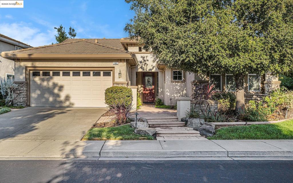 Located in Summerset 4, a sought-after 55+ community, this Edgewood model offers a blend of comfort, space, and thoughtful design. Two spacious bedroom suites are thoughtfully positioned on opposite sides of the home, ensuring privacy for residents and guests alike. Built-in shelving in the primary bedroom’s walk-in closet maximizes organization and storage. A double-sided gas fireplace serves as a warm centerpiece, seamlessly connecting the living room and dining room areas. Hardwood floors add warmth and timeless appeal to the home. The kitchen opens directly into the cozy family room, creating an inviting open-concept layout ideal for entertaining and daily living. Bay windows in both the family room and the primary bedroom bathe the interiors in natural light. A large laundry room provides extra storage space, enhancing the home's functionality. The office features wall-to-wall bookshelf, perfect for book lovers or those who work from home. The expansive, landscaped backyard offers a serene outdoor retreat. Come join this wonderful 55+ community with all its amenities: lodge, ballroom, gym, game rooms, library, tennis & pickle ball courts, bocce courts and our own 3 acre park with picnic tables and BBQs and activities too numerous to mention! Life is good here!