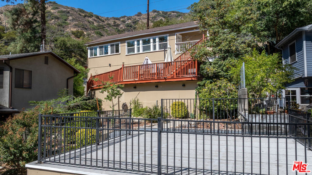 Peaceful Hillside Living in Burbank. Located in the award-winning Burbank Unified School District, this updated 2-bedroom, 2-bath home offers a smart floor plan with vaulted beamed ceilings, natural light, and wraparound views from the living, dining, and main bedroom. Recent upgrades include a new roof, copper plumbing, newer windows, HVAC and ducting, plus a remodeled kitchen with modern cabinetry, counters, and stainless steel appliances. The living room features a gas fireplace and custom bookshelves, opening to a large deck with sweeping mountain and canyon views. Additional features: A bonus room ideal for a gym, studio, or office; a detached 2-car garage with an EV charger; and an expansive rooftop deck. With its size, utilities nearby, and private access, the rooftop deck presents a prime opportunity to build a fully functional ADUperfect for guest quarters, rental income, or multi-generational living; Expansive hardscape for entertaining or play; Private hiking trail with direct access to Glendale; Just minutes from downtown Burbank's shops, dining, and entertainment.