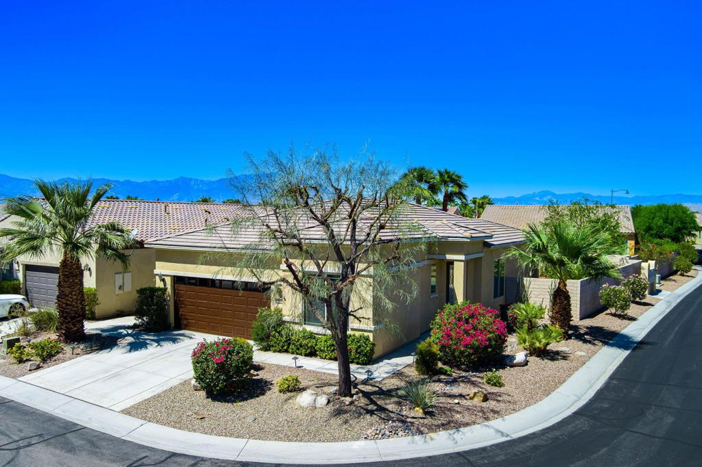 Offered TURNKEY FURNISHED, this charming home in the highly sought-after active adult community of Sun City Shadow Hills has been lovingly maintained, offering an ideal blend of comfort and low-maintenance living. The popular Embark floor plan features an open-concept layout that ensures privacy between bedrooms while maintaining a spacious and airy flow throughout the home. You'll appreciate the easy care tile and wood laminate flooring throughout, crown moulding, and ceiling fans in every room, adding to the home's comfort and style. The chef-inspired kitchen is perfect for both everyday cooking and entertaining, offering rich wood cabinetry, modern appliances, and plenty of counter space. The PREMIUM CORNER LOT is a true sanctuary with its expansive and professionally landscaped backyard, providing a serene environment all year round. Enjoy the spacious covered patio with an extended trellis, providing ideal shade and sun protection, keeping the home cooler even on the hottest desert days. A standalone gazebo adds a touch of elegance and valuable shade for outdoor relaxation and entertaining. As part of the vibrant Sun City Shadow Hills active lifestyle, you'll have access to resort-style amenities including golf, tennis, pickleball, bocce, and sparkling pools and spas. Two beautiful clubhouses offer even more opportunities to stay active and social. This home is ready for you to start living the Sun City lifestyle.