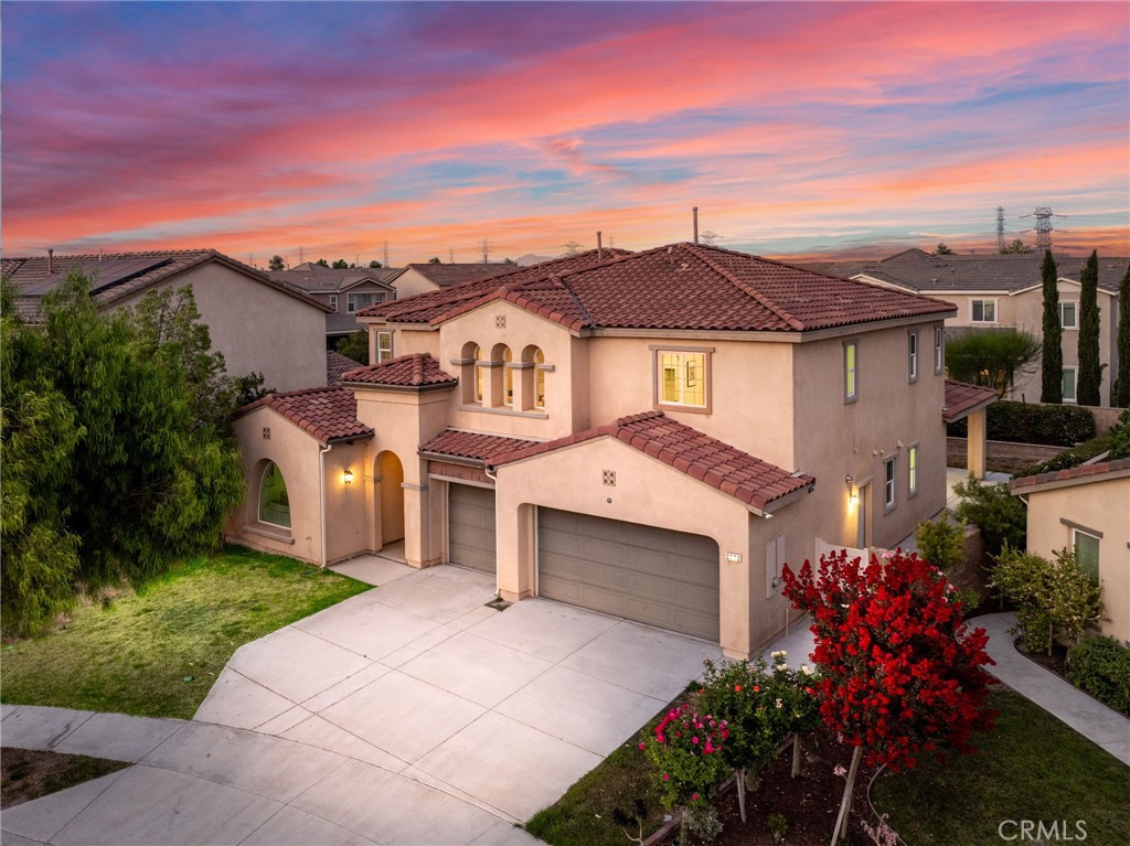 Indulge in elegant Park Place Community, this exquisite home offers modern comfort and elegant design throughout. Every inch of this architect-driven, open-concept home has been carefully curated with structure and entertainment in mind. Radiating an encapsulates luxury living at every turn. This meticulously home offering a rare and inviting opportunity intentional, intimate environment where nature's beauty converges with architectural artistry, manifesting as the ultimate sanctuary for harmonious living at the end of a private cul-de-sac. Step into a bright and open-concept living space where contemporary flooring flows seamlessly from the living room to the gourmet kitchen. The spacious family room, anchored by a cozy fireplace, opens seamlessly to a chef’s kitchen featuring an oversized granite island, a perfect setting for both daily living and entertaining. Kitchen is complemented with cabinetry that provides ample storage and sleek stainless steel appliances. Adjacent to the kitchen is a welcoming dining area, with sliding glass doors that open to picturesque backyard—ideal for entertaining or enjoying quiet moments outdoors. A spacious bonus room connects the garage to the dining area, making it a perfect space for a home office. Main-Level convenience a mother-in-law bedroom offers comfort and accessibility for guests or multigenerational living. Second-Floor Features Upstairs, you’ll find a spacious loft that adds versatility to the layout. Retreat to the luxurious primary suite with a soaking tub, separate shower, and generous walk-in closet. It abundant natural light and generous space. A secondary bedroom with its own private bathroom is perfect for a teen or young adult, while two additional bedrooms of the home share a full hallway bathroom. The laundry room is also conveniently located on the second floor. Community Amenities Park Place offers resort-style living with a wide range of amenities. A luxurious clubhouse for events and gatherings. This one of a kind opportunity to own this generational treasure is a dream brought to life. Must be experienced to truly appreciate its pristine and unparalleled beauty.