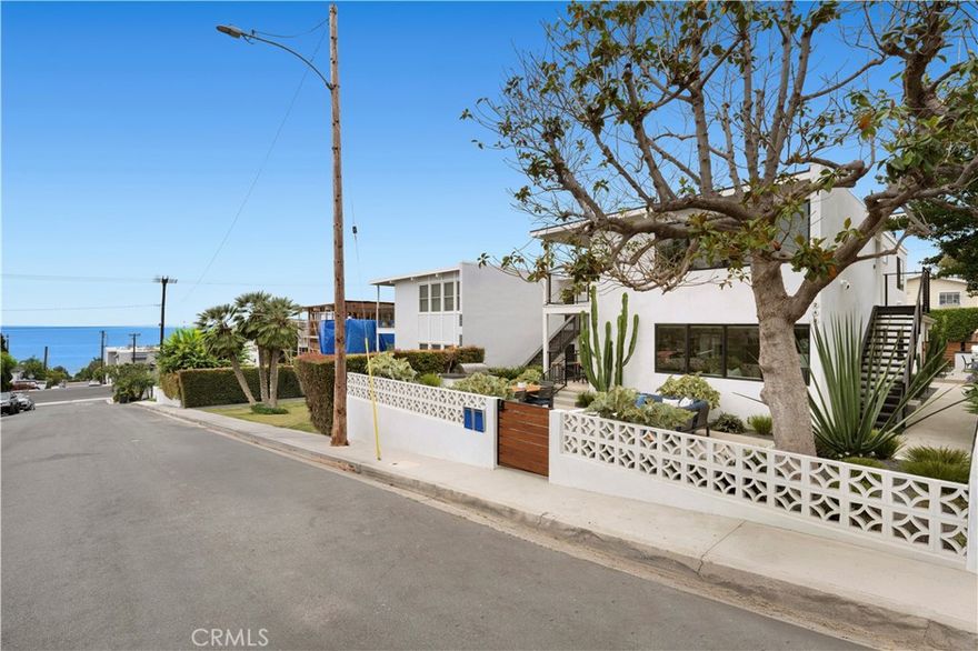 In coveted North Laguna Beach, this thoroughly reimagined duplex, renovated by MAR Development, offers two beautifully remodeled 2-bedroom residences, each showcasing high-end finishes, designer fixtures, premium appliances, and in-unit laundry. With sweeping ocean views from both levels, this is a rare opportunity for elevated coastal living or investment. Both units have been extensively upgraded in 2023, including electrical, plumbing, HVAC with central air, roof, windows, doors, cabinetry, appliances, baths, flooring, and custom landscaping - reflecting the quality and craftsmanship of a full-scale renovation. The upper unit features 2 bedrooms, 2 bathrooms, and a private deck off the kitchen that captures breathtaking ocean vistas - perfect for dining al fresco or enjoying the sunset. The lower unit mirrors the same thoughtful upgrades and boasts exclusive access to a custom-designed patio complete with built-in fire pit, outdoor BBQ, and lush landscaping - ideal for entertaining or quiet relaxation. Located just one block from Shaw’s Cove Beach, and tucked between Fisherman’s Cove and Crescent Bay - an area treasured for its natural beauty and hidden-gem feel. Additional highlights include a private storage unit and a two-car carport. Just moments from iconic beaches, art galleries, shops, and restaurants.