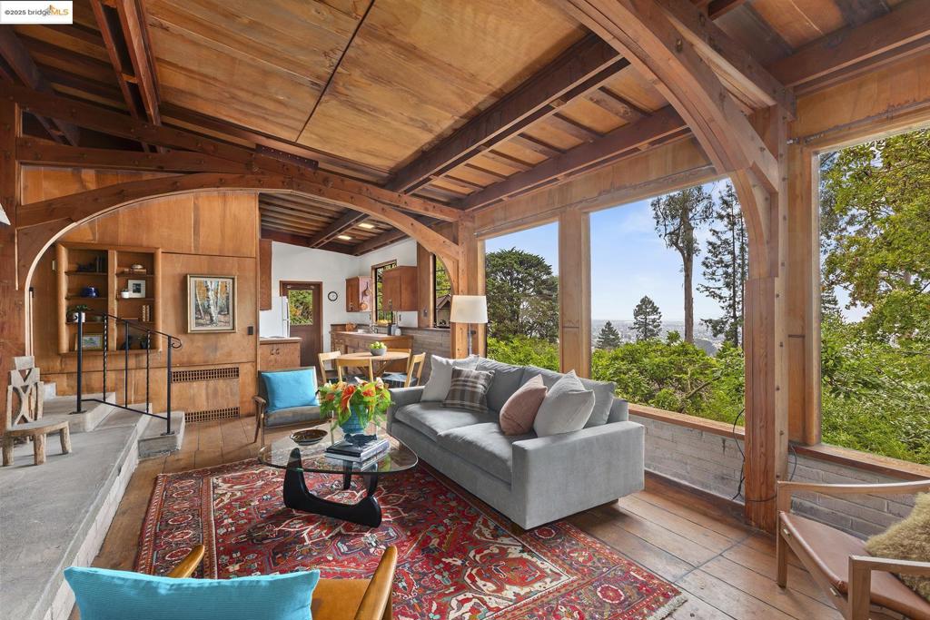 NO OPEN HOUSES. VIEWABLE W/AGENTS. 2 Maybeck Twin Drive, known as Arillaga, is the last home Bernard Maybeck designed. Created in 1951 for his son and daughter-in-law, Wallen & Jacomena & built by Jacomena’s cousin Robert “Red” Kleyn-Schorel, this 2-bd, 1-ba residence rests on an expansive 10,434 sq ft lot in a private enclave, rich with architectural history. The home blends mid-century simplicity—low-slung lines, open glass windows, plywood & a flexible floor plan—with classic Maybeck elements, including steel windows, a striking raised-hearth fireplace & arched beams. Many original details remain intact: navy hatch cover flooring in the living room, Hawaiian sweet gum plywood ceilings, radiant heat in the concrete floors & a warm concrete hearth designed for gathering. Mostly in original condition, Arillaga is ready for thoughtful updating and offers tremendous potential to enhance its character. The property’s verdant setting includes Bay views that can be further opened with tree trimming & landscaping. A lower-level garage exists, though there is also the level-in driveway. Set on Maybeck Twin Drive, near North Berkeley shops, Arillaga offers architectural provenance, vintage charm & exciting possibilities in a nbrhd of landmark homes by renowned 20th-century architects.