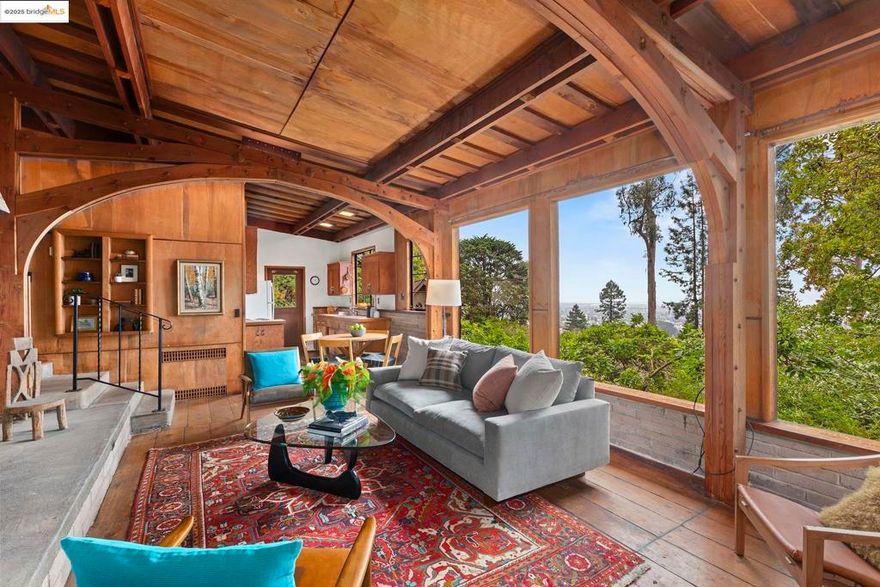 NO OPEN HOUSES. VIEWABLE W/AGENTS. 2 Maybeck Twin Drive, known as Arillaga, is the last home Bernard Maybeck designed. Created in 1951 for his son and daughter-in-law, Wallen & Jacomena & built by Jacomena’s cousin Robert “Red” Kleyn-Schorel, this 2-bd, 1-ba residence rests on an expansive 10,434 sq ft lot in a private enclave, rich with architectural history. The home blends mid-century simplicity—low-slung lines, open glass windows, plywood & a flexible floor plan—with classic Maybeck elements, including steel windows, a striking raised-hearth fireplace & arched beams. Many original details remain intact: navy hatch cover flooring in the living room, Hawaiian sweet gum plywood ceilings, radiant heat in the concrete floors & a warm concrete hearth designed for gathering. Mostly in original condition, Arillaga is ready for thoughtful updating and offers tremendous potential to enhance its character. The property’s verdant setting includes Bay views that can be further opened with tree trimming & landscaping. A lower-level garage exists, though there is also the level-in driveway. Set on Maybeck Twin Drive, near North Berkeley shops, Arillaga offers architectural provenance, vintage charm & exciting possibilities in a nbrhd of landmark homes by renowned 20th-century architects.