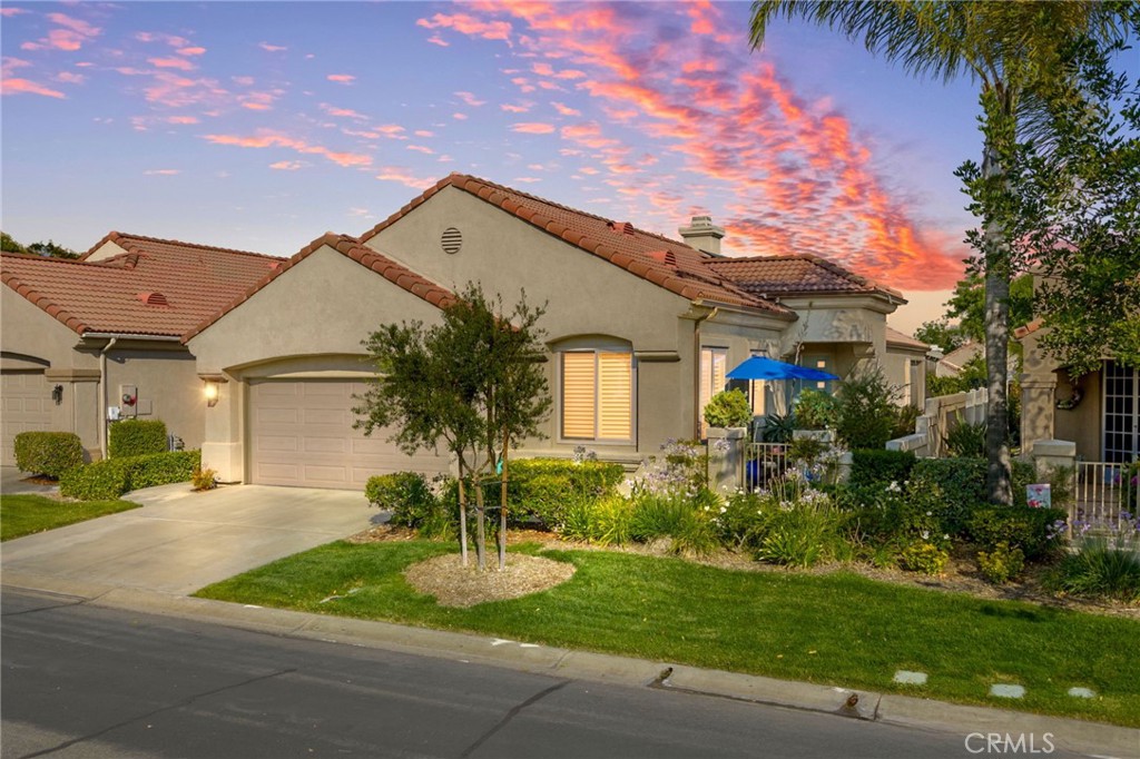 $310,000 in custom upgrades plus PAID OFF solar! Step into this stunning, completely renovated single-story 2-bedroom, 2-bathroom home in the highly sought-after 55+ community of The Colony—where luxury, convenience, and community come together. With 1,495 sq. ft. of living space and over $310,000 in premium upgrades, this home has been meticulously transformed inside and out. Enjoy peace of mind and energy savings with OWNED solar, new HVAC with an electrostatic air filter, QuietCool whole house fan, six-stage water filtration system, all-new dual pane heat-protective windows, and new electrical throughout. The HVAC, garage door, and irrigation system are all Wi-Fi enabled for smart home control. Cat 6 wiring runs to every room, ensuring fast and reliable internet connectivity throughout the home. The heart of the home is the elite custom kitchen, featuring soft-close cabinetry with a lifetime warranty, easy-to-reach microwave, custom backsplash, 6-burner range, and built-in cupboards for maximum storage. The bathrooms, flooring, tile, interior doors, shutters, hardware, and even the ceilings have all been redone with top-tier finishes. Both bathrooms are outfitted with luxurious towel heaters, and every closet features custom organizers and cedar lining for a fresh, clean finish. Brand new Quartz countertops, ceiling fans, and fresh interior and exterior paint add to the home’s refined and cohesive look. Washer, dryer, and refrigerator are included. Relax in the newly designed living room with its upgraded fireplace, modern fan, and enhanced lighting, or entertain in style in the incredible backyard oasis—complete with new concrete, an Alumawood patio cover with 3-inch insulation and built-in halogen lights, retractable patio shades, and a professional-grade Bigg Fog patio misting system. Outdoor accent lighting enhances curb appeal and sets the perfect evening ambiance. The two-car garage is a true showpiece with epoxy floors, custom cabinetry, recessed lighting, a full workbench, sink, and even a sitting area—perfect for hobbies, projects, or extra storage. It also features a premium LiftMaster Elite Series wall-mount garage door opener for a sleek and quiet upgrade. Located in The Colony, one of the area’s most vibrant active adult communities, residents enjoy pickleball, tennis, swimming pool, spa, a clubhouse, numerous social activities, and clubs. This turn-key gem is not just a home—it’s a lifestyle upgrade.