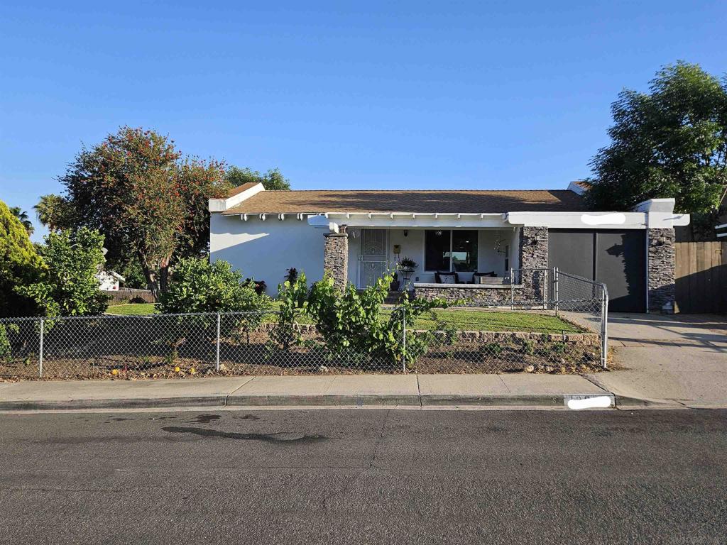 Cute family home in the center of Poway, Walking distance to shops, restaurants and school bus stop across the street. Family oriented neighborhood with kids and fun adults.. Gated yard front and back so your kids or pets can run freely. Kitchen was just remodeled and we are in the process of painting all rooms. We will have the house professionally cleaned along with all windows and window sills. No garage but plenty of storage with a large shed in the back yard and a good size area in the front of (what used to be the garage) There is a chicken coop in the back yard and the owner will either leave the chickens or will re home them..