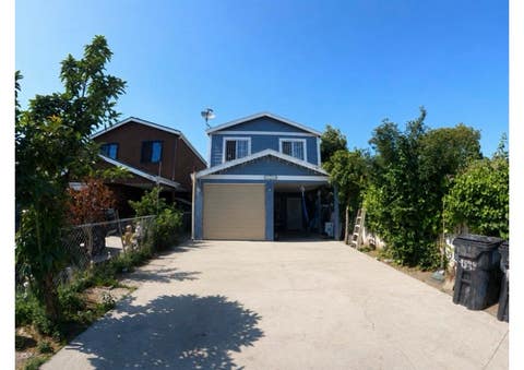 Photo of 1243 E 100th St, Los Angeles, CA 90002 (MLS # CV26091339)