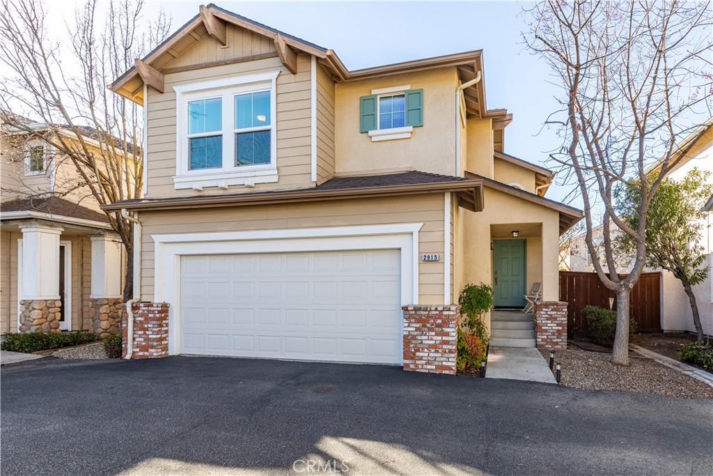 Looking for an affordable clean home within nice neighborhood, close to schools, shopping and all the other wonderful things Paso Robles has to offer? Well you have found it at 2915 Cottage Lane of Paso Robles! This adorable home is conveniently located in the gated community of The Cottages at River Oaks. Walk onto the front porch and into a 3 bedroom, 2.5 bath home, covering 1192 sq ft, an open floor plan, high ceilings, laminate flooring and natural abundant light. Kitchen has quartz counter tops that opens to a dining area, that leads to a lovely private backyard that is all set with a drip system. Living room has built in cabinets and an electric fire place. Downstairs is also the half bath convenience for guests. Upstairs has all new carpeting, where you will find the three bedrooms. Primary bedroom has 2 full closets and it's own bathroom with quartz countertops. The garage is all with floor to ceiling cabinetry and extra storage. The Cottages community has everything you need! While it includes a heated pool & clubhouse, the HOA also includes the maintenance of the common areas, cable TV, high speed internet. This property is in close proximity to River Oaks Golf Course and hot springs, The Ravine water park, wineries, and easy access to HWY 46 and HWY 101. Don't miss this opportunity to own a great home in an amazing location!