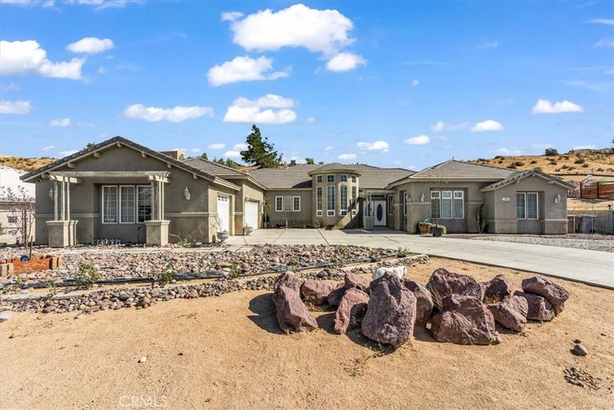 This stunning, custom-built estate offers 3,438 square feet of living space on a huge 37,000 sq. ft. (Approx) lot is designed for versatility and upscale living. The flexible floor plan is a dream for multi-generational living, featuring two complete primary bedroom suites with private en-suite baths. Entertain effortlessly in the spacious formal dining room or gather around one of two cozy fireplaces that anchor the light-filled family room. With a massive driveway for guest parking, entertaining will be a new norm.  Blessed with a 3-car garage and an enormous backyard,  options for expansion or income generation is available. Situated in a mature, sought-after neighborhood, this property delivers scale, style, and endless potential.