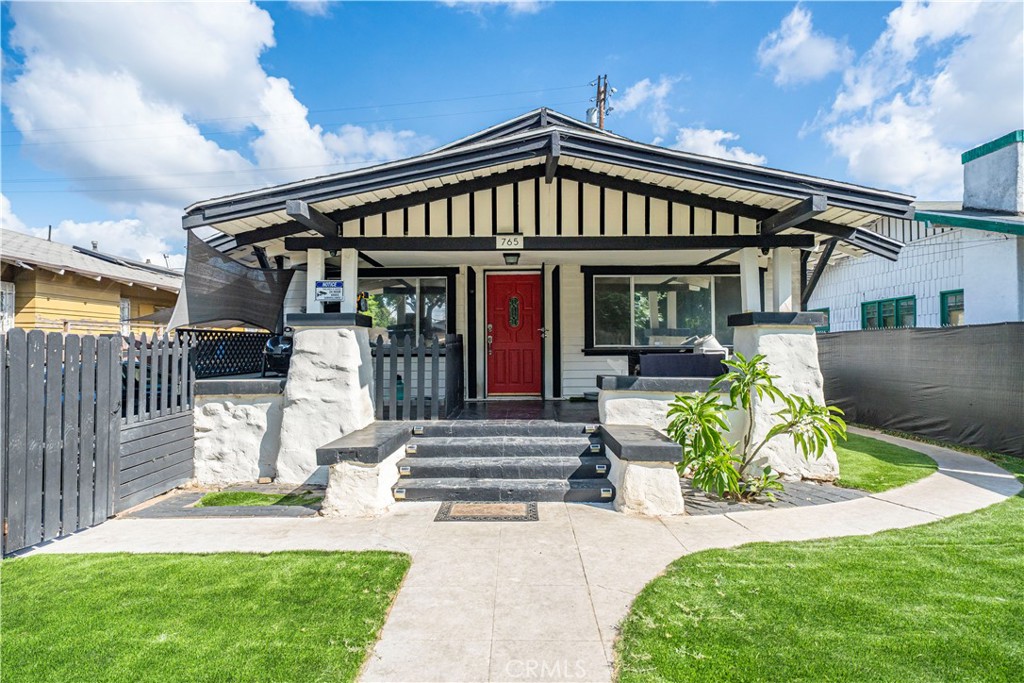 Beautiful 2 Bedrooms / 1 Bath home used as 3 Bedrooms / 2 Bath; gated with a gorgeous front porch, laminated floors, remodeled bathrooms, dining area, upgraded lighting, laundry room, detached garage, long driveway, security camera system; pride of ownership, close to DTLA and public transportation.