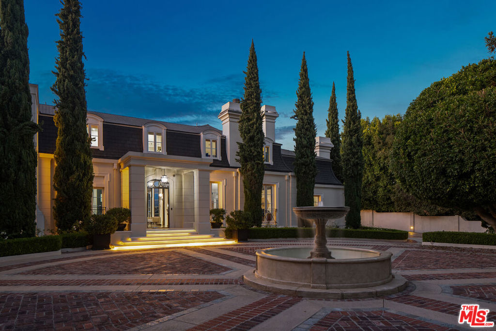 Discover unmatched luxury at Bellagio Estate, where custom-designed furnishings by Ralph Lauren and cutting-edge sound technology create an extraordinary atmosphere. Hidden behind elegant iron gates and accessible via a private driveway, this remarkable property is among Bel Air's most coveted. Rebuilt with meticulous attention to French-inspired elegance, the estate features manicured gardens, vast lawns, and a breathtaking pool area complete with a fire pit and putting green -- all with views of the Bel Air Country Club Golf Course. Inside, find grand living spaces including a majestic living room with a conservatory, a formal dining room, and a two-story library/office. The gourmet kitchen flows into a spacious family room and is enhanced by a screening room and a walk-in wine cellar. The home offers two lavish master suites, four Ralph Lauren-designed bedroom suites, and three staff apartments. A professional Butler's pantry ensures effortless entertaining, while an iPad-controlled smart home system enhances convenience and security. Bellagio Estate provides a rare opportunity for refined living in a highly sought-after location.