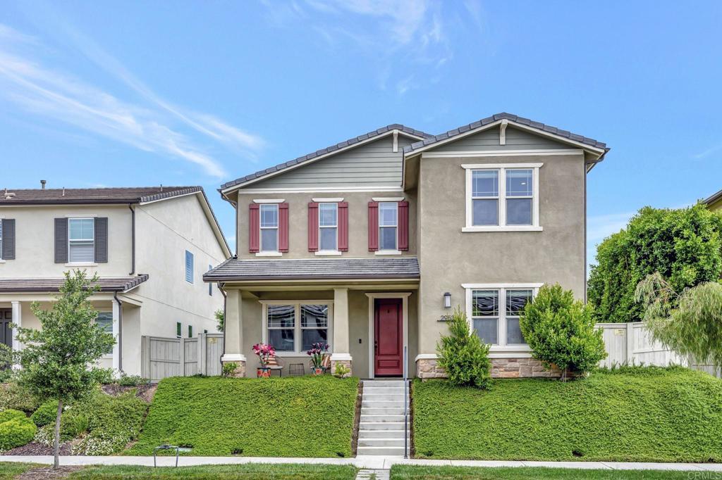 This beautiful Andalucia home in Harmony Grove Village offers a perfect blend of comfort, space, and functionality and features 5 bedrooms, 4 full bathrooms, 2 half bathrooms, an office, and rec room above the garage. It includes a first level bedroom & private bathroom, owned solar panels, tankless water heater, stacking door system, closet systems, built-in book shelves, California Room, lush landscaping, and a true three-car garage. The kitchen boasts upgraded flooring, white cabinets, a large island with seating, pendant lighting, full custom tile backsplash, under cabinet lighting, stainless steel appliances, double ovens, built-in trash receptacles, and a walk-in pantry. Sliding glass doors lead to the California Room for seamless indoor-outdoor living. The kitchen opens to a spacious dining area, which flows into the family room, creating an open-concept layout ideal for everyday living and entertaining. The primary suite features recessed lighting, a ceiling fan, and multiple windows. The en-suite bath offers two walk-in closets, dual sinks with under-cabinet storage, an oversized mirror, a soaking tub, a private toilet room, and a floor-to-ceiling tile walk-in shower with a bench and glass door. The downstairs features a private office with a built-in bookshelf and large windows. The family room includes a built-in entertainment area with lower cabinetry and expansive windows on both sides, filling the space with natural light. It flows seamlessly into a covered California Room, extending the living area outdoors. The stairway features recessed lighting and a window for natural light. The landing offers floor-to-ceiling built-in cabinets. The laundry room includes a sink and lower cabinet storage, and hanging racks. Additional upstairs bedrooms include recessed lighting and ceiling fans. One has a walk-in closet and is currently used as an office. Another features a built-in bookshelf, deep closet with built in cabinets/drawers, and an attached bathroom with an updated tub/shower combo and glass door. Outside, the spacious courtyard-style layout provides ample room for additional seating, outdoor dining, or lounging. A covered breezeway connects the main home to the garage and serves as a versatile space, perfect for a workout area, outdoor kitchen setup, or shaded seating. The backyard offers a tranquil retreat with a soothing water feature, mature landscaping, and a staircase that leads to the upper-level rec room above the garage. This bonus space features a large living room with a big window for natural light, along with a dedicated office nook complete with a built-in desk and lower cabinet storage. A convenient half bathroom makes it ideal for guests, remote work, or flexible use. Harmony Grove Village is a master planned community with gorgeous mountain ridgeline views, multipurpose trails, gated pool for homeowners, dog and equestrian park, multiple private parks and the huge 4th of July Park (open to the public). The Grove is the perfect place to enjoy the outdoors- it includes the pool, jacuzzi, wading pool, barbecues, shaded tables, play structure and a covered lounge area w/ outdoor furniture and fireplace.