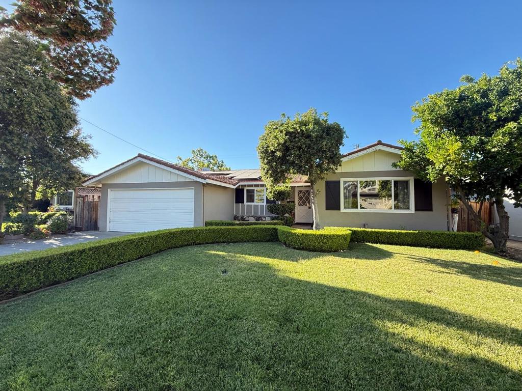 Exquisitely remodeled, this 4-bedroom San Jose residence blends timeless elegance with modern functionality. Updated in 2017, the home features vaulted ceilings, hardwood floors, crown molding, recessed lighting, and thoughtfully designed living spaces. The chefs kitchen is appointed with quartz countertops, high-end stainless steel appliances, a wine fridge, and a spacious wet barperfect for entertaining in style. Folding Catalina doors open to a beautifully landscaped backyard, creating seamless indoor-outdoor living. The bathrooms have been tastefully renovated with designer finishes, while the newer plumbing system offers added peace of mind. Sustainability meets sophistication with an owned solar system (installed in 2016), Tesla charger, durable metal roof, and central A/C for year-round comfort. Located near top amenities and zoned for highly rated Oster Elementary, this home presents a rare opportunity to enjoy luxury, efficiency, and convenience in one of San Joses most desirable neighborhoods.