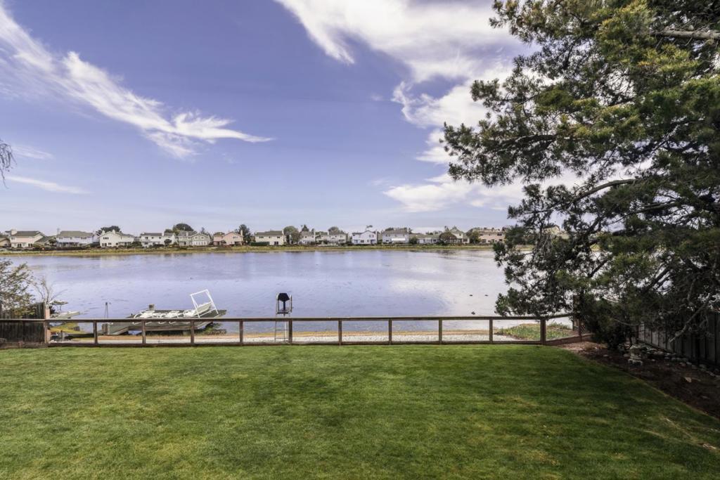 Warm Southern exposure greets as the rising sun glistens off the serene waterfront of your rarely available luxurious, 2 bedroom, one full bath, recently renovated garden level end unit, with commanding views from a wide sliding door that brings the outdoors inside with a large covered patio to the lush backyard and gated dock. Hot and cold water rinse off shower at the dock. Enjoy skiing, boarding or rowing and paddling sports.Available unfurnished for a in mid July move in. 3D virtual staging images used with recent images. New photos available after new carpet install in early July. Your chefs kitchen awaits, Stainless appliances, new quartz, convection wall oven, refrigerator with ice and water service. New quartz in bath, shower and vanities, new mirrors and toilets. Two large bedrooms and views to the hills from one. Whether water skiing the slalom course at first water, rowing, paddling, boarding or enjoying a book from the furnished outdoor dock on this tropical Mid-Peninsula 4 mile waterway paradise with stunning water views amid a Belmont San Mateo hills backdrop to the South and West. 2 car parking 1 in carport one in driveway. Bike locker or storage. Your space in the heart of the Peninsula!