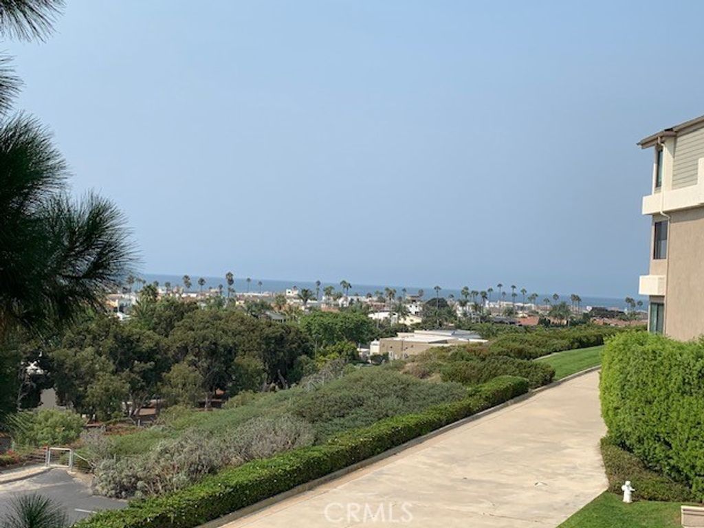 Photo of 280 Cagney Lane #215, Newport Beach, CA 92663 (MLS # OC25242231)
