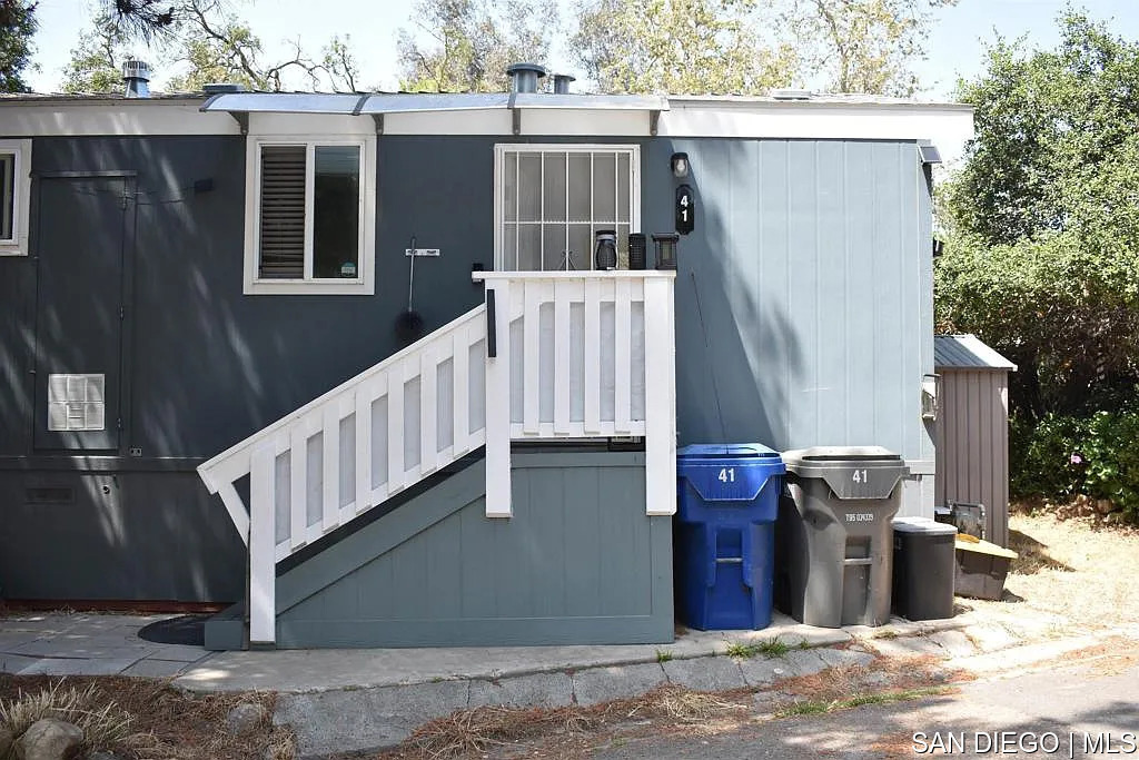 Welcome to Flinn Springs Mobile Home all ages park in El Cajon. This 1 bedroom, 1 bathroom manufactured home features living area and functional kitchen. Has front and back entrances and a pleasant creek that runs through the property. Space rent 840.00 month