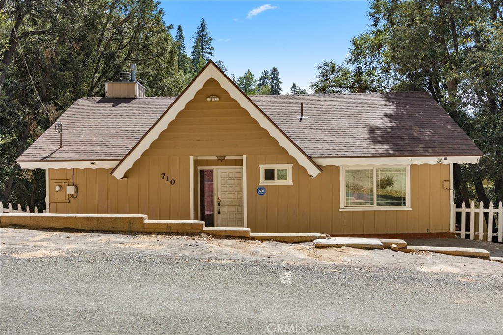 Welcome to 710 Arbula Dr, nestled in the charming San Moritz area—an inviting mountain retreat perfect for buyers, investors, and owner-occupants alike. This cozy and comfortable 4-bedroom, 2-bath home spans 1,672 square feet and captures the essence of a true cabin-style getaway with its warm ambiance and thoughtful design. Upon entry, you're welcomed by soaring cathedral-vaulted ceilings and a stunning stone fireplace that anchors the living space, offering the perfect place to relax during cool mountain evenings. The kitchen features beautiful granite countertops, adding a touch of modern elegance to the rustic charm. A dedicated laundry room adds convenience, while the spacious pool table room creates a fun and social environment for entertaining family and friends. Each bedroom offers a peaceful escape, making this home ideal for both full-time living and weekend getaways. Located in a serene and quiet setting, surrounded by nature, 710 Arbula Dr is more than just a home—it’s a lifestyle. Whether you're looking for a personal retreat, a rental investment, or a combination of both, this property offers versatility, comfort, and the welcoming cabin feel you’ve been dreaming of.