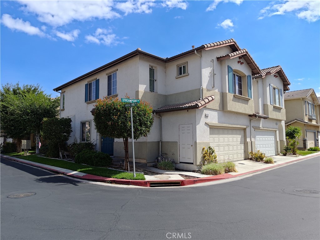 Corner Lot Town Home Situated at Beautiful Riverwalk Community, 3 Bedrooms / 2.5 Baths with A Loft in Upstairs, Granite Tile Counter Tops w/ Island, Newer Dishwasher, Microwave, Open Floor Plan, Tile Floor at Entry, Hall, Kitchen, Dining Area and Bathrooms. The HOA Amenities Including A Swimming Pool and Tennis Courts! Walking Distance to La Sierra University, Easy Access to FWY 91 & 15. This Is A Great Community To Live In!
