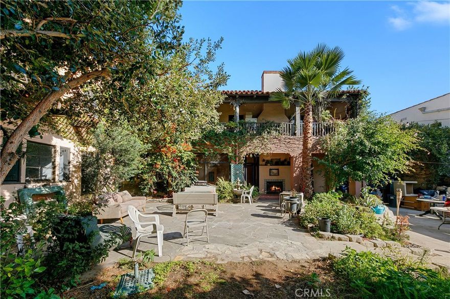 Rare Fixer Opportunity on a Double Lot in Prime Miracle Mile! Welcome to this incredible fixer-upper with endless potential, located on a double-sized lot in the highly sought-after Miracle Mile neighborhood. This one-of-a-kind property offers 8 bedrooms, 6 bathrooms, and nearly 6,000 square feet of living space on an expansive 11,000-square-foot lot a rare find in this premier location. Built in 1929, this home retains its timeless old-world charm, featuring high ceilings, oversized windows, a grand fireplace, arched doorways, and original hardwood floors throughout. The layout includes spacious bedrooms, ample storage, and multiple outdoor spaces, including a deck off the primary bedroom overlooking the street and a large balcony facing the backyard. Step outside to a massive backyard, perfect for entertaining, family gatherings, BBQs, or simply enjoying the California sunshine. A long driveway accommodates multiple cars and leads to a detached 3-car garage. Originally constructed as a duplex, the property was converted to a single-family home on title, but it still functions as two separate units with two addresses. This makes it ideal for buyers seeking flexibility, whether to create a grand single-family estate or to restore it as two spacious units for multi-generational living or rental income. Zoned LAR2 / HPOZ, this property offers incredible possibilities for renovation, expansion, or redevelopment. Located just moments from The Grove, LACMA, La Brea Tar Pits, and the area’s best shopping, dining, and entertainment, this is your chance to bring your vision to life in one of Los Angeles’s most desirable neighborhoods. Bring your imagination and transform this classic Miracle Mile gem into something truly extraordinary!