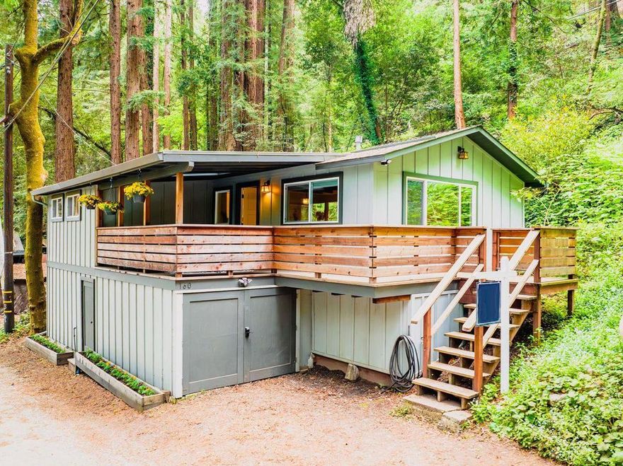 Super charming Ben Lomond home - this can be your place to truly relax and enjoy the Santa Cruz mountains & redwoods.  This home was extensively remodeled circa 2019 and features gorgeous wood floors, exposed beam ceiling in the living room, skylights & double paned windows.  Enjoy coffee on your inviting covered front porch and take in the views of the trees.  The main bedroom has it's own private balcony, high ceilings & cork floors. The bonus room has brand new carpet, skylight and lots of windows to let in the light.  The kitchen features a gas stove, skylight and plenty of counter space.  There is a nook in the kitchen that has been used as a great office area.  Under the home you will find a workshop area and extra storage.  This is a charming retreat home with modern updates.  Welcome home!