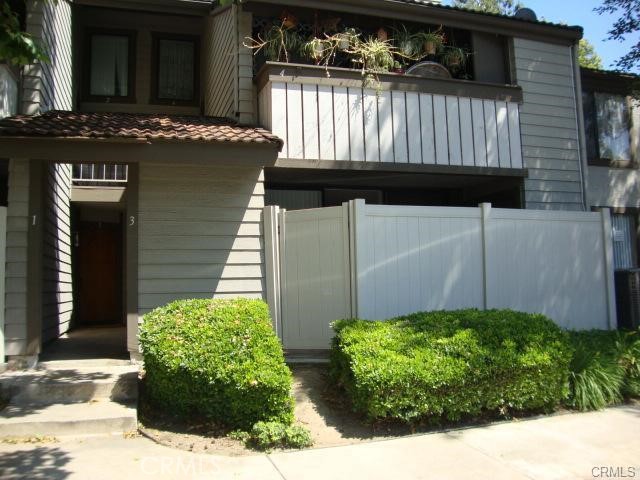 Bright and light condo in Philliphs Ranch. The charming property features 3 bedrooms, 2 bathrooms with 1 car detached garage. Wood floor and new fresh paint throughout. Granite counter top in both bathrooms plus water filter in kitchen. Inside laundry in the patio. Well maintain community with pools and spas. Super convenient to walk to shopping center and supermarket. This one won't last.