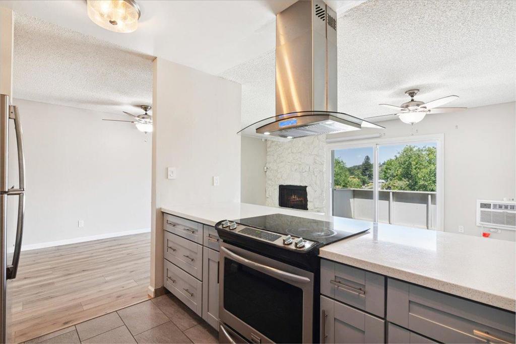 Beautifully updated 3BR, 1.5BA end unit at Creekside Park. With no adjoining walls, this home provides exceptional privacy. As you enter, you'll be greeted by an open living area that bathes in natural light and features a cozy wood-burning fireplace. This inviting space extends onto a deck that offers scenic neighborhood views, perfect for relaxation. The spacious dining area seamlessly connects to an airy, remodeled kitchen. Here, you'll find newer stainless-steel appliances, a breakfast bar, and elegant counters, making it a delightful space for culinary endeavors. Enjoy two distinct outdoor areas, including a private, fenced patio and a separate deck, providing ample opportunities to take advantage of the California climate. Take advantage of the convenience offered by an indoor laundry area featuring a washer and dryer. Situated well off Pleasant Hill Road, this residence boasts a tranquil setting with a sparkling pool and two parking spots: one carport and one open space. You'll appreciate the abundance of amenities just around the corner, including restaurants, cafes, and shops. Plus, it's a short distance to miles of walking and bike trails, and nearby neighborhood parks offering recreational options. With easy access to highways 24 and 680, commuting is a breeze.