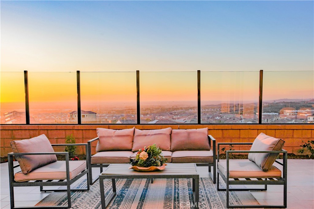 Incredible Views! Ocean view! City light! Stunning Sunset! Catalina Island! Everything you want! Welcome to 137 Oakstone Irvine in Portola Springs.
Prime location cul de sec !
Stunning panoramic view of the city light and breathtaking sunset, Nestled in the top of the city, this exquisite urban landscape property offers an unparalleled blend of modern luxury and natural beauty. this residence is the epitome of sophisticated living. Spacious and Elegant Interiors This magnificent villa boasts four spacious bedrooms, each designed with comfort and style in mind. The master suite features oversize windows, allowing residents to wake up to the dazzling city view and witness the absolute beauty of the sunset. Three elegantly designed bathrooms complete with high-end fixtures and offer unique views such as mountain views. Awe-Inspiring Living Spaces The first floor of the villa is designed to maximize both comfort and aesthetics. The open-concept living room, dining area, and kitchen create a seamless flow, perfect for both relaxation and entertainment. Large floor-to-ceiling windows flood the space with natural light, offering an unobstructed view of the cityscape and mesmerizing sunsets. Whether enjoying a quiet evening with family or hosting guests, the ambiance is nothing short of spectacular. At dusk, residents can gaze out over the Newport coastline and Fashion Island, while at night, they can take in the dazzling city lights from master bedroom. Prep Kitchen with Scenic Views This villa features a Prep-kitchen design, catering to both convenience and style. The fully-equipped gourmet kitchen is a culinary enthusiast’s dream, featuring top-of-the-line appliances, upgraded countertop. Additionally, the secondary kitchen also offers scenic views, making every meal preparation a delightful experience. A Perfect Blend of Serenity and Urban Convenience The strategic design ensures privacy and tranquility while maintaining easy access to the vibrant urban lifestyle.
Nearby, residents can find premium Spectrum shopping centers, fine dining establishments, and cultural attractions, all just minutes away. Easy to access freeway 241,5,and 133. This urban landscape villa is more than just a residence—it is a sanctuary of luxury, comfort, and breathtaking views. Experience the perfect balance of modern elegance and natural charm in the heart of the city.